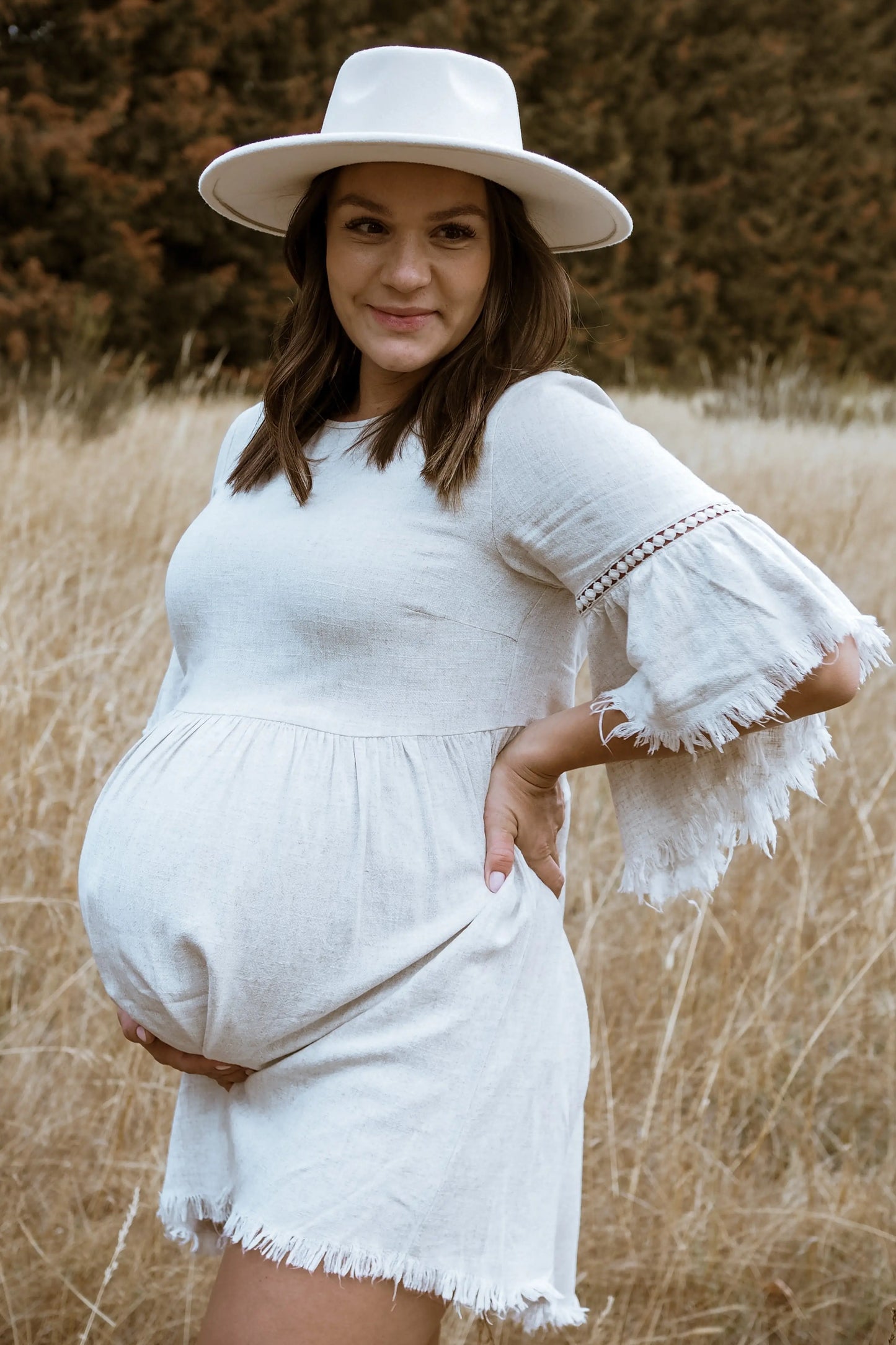 Beige Raw Edge Bell Sleeve Babydoll Maternity Dress with Crochet Trim and Back Keyhole Cutout PinkBlush