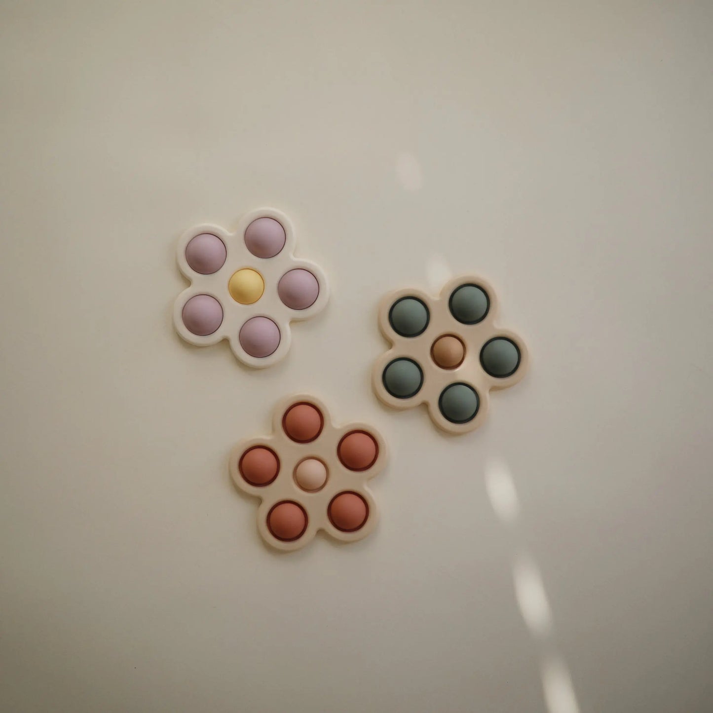 Flower Press Toy for Fine Motor Skills and Sensory Exploration Mushie Everetts Place: Online Boutique