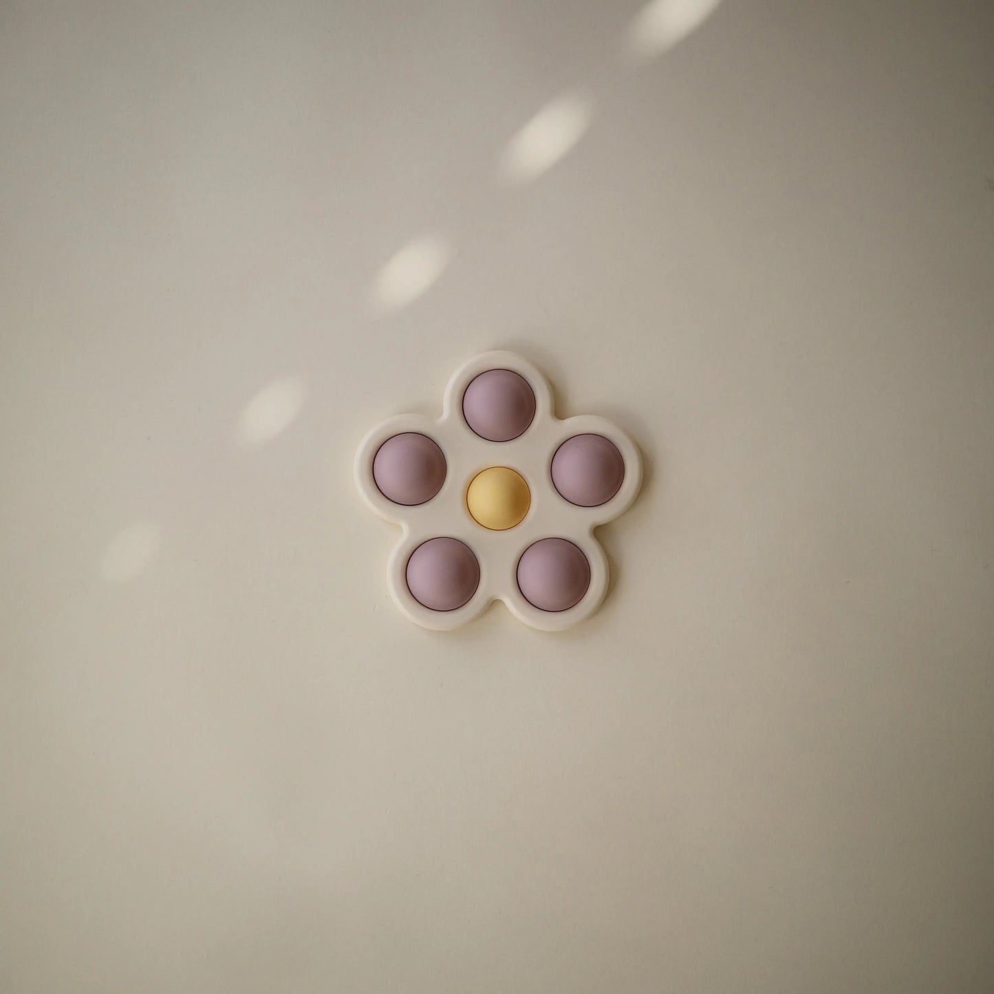 Flower Press Toy for Fine Motor Skills and Sensory Exploration Mushie Everetts Place: Online Boutique
