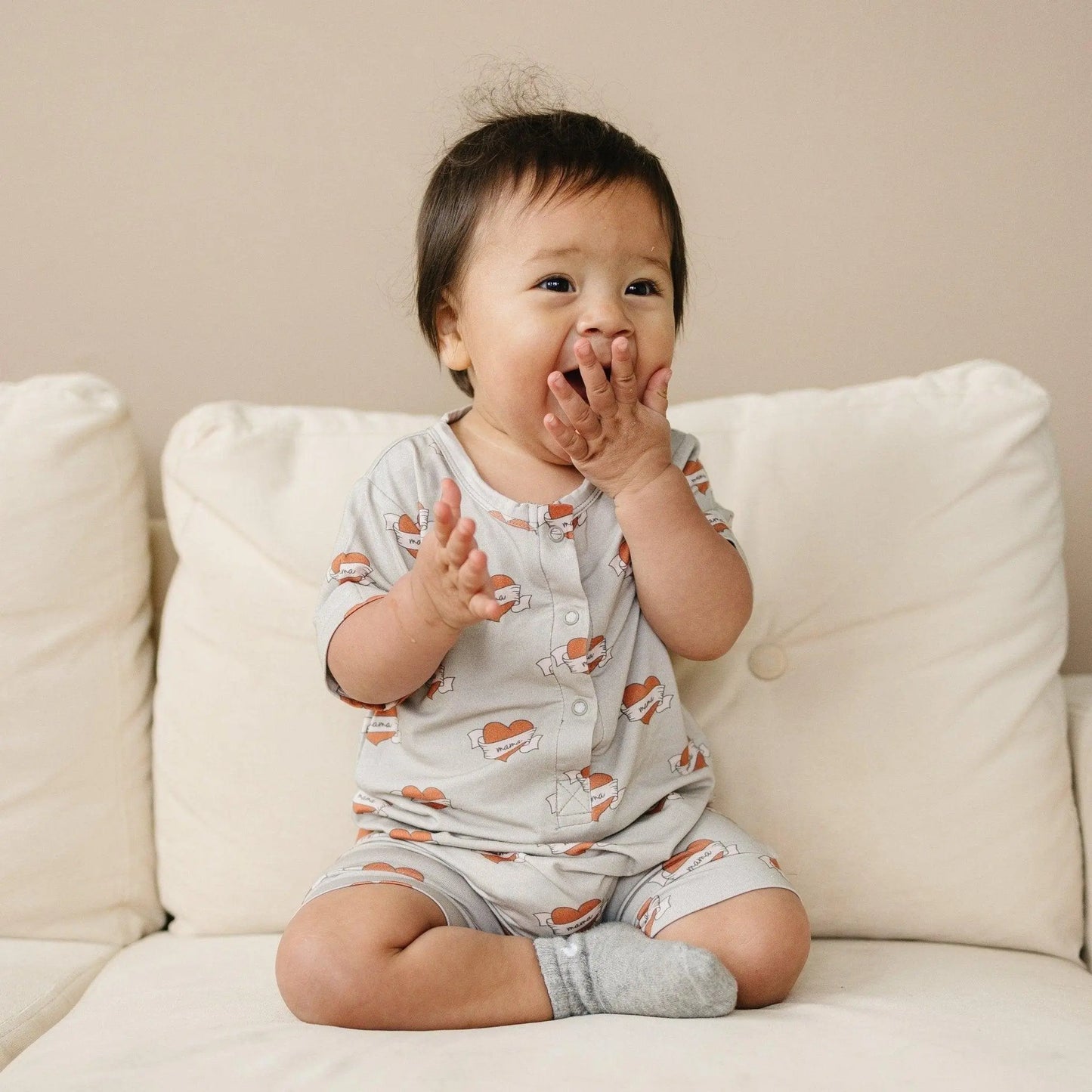 Little Joy Co. Mama Tattoo Hearts Bamboo Henley Romper for Babies - Apparel & Accessories > Clothing > Baby & Toddler Clothing > Baby One-Pieces