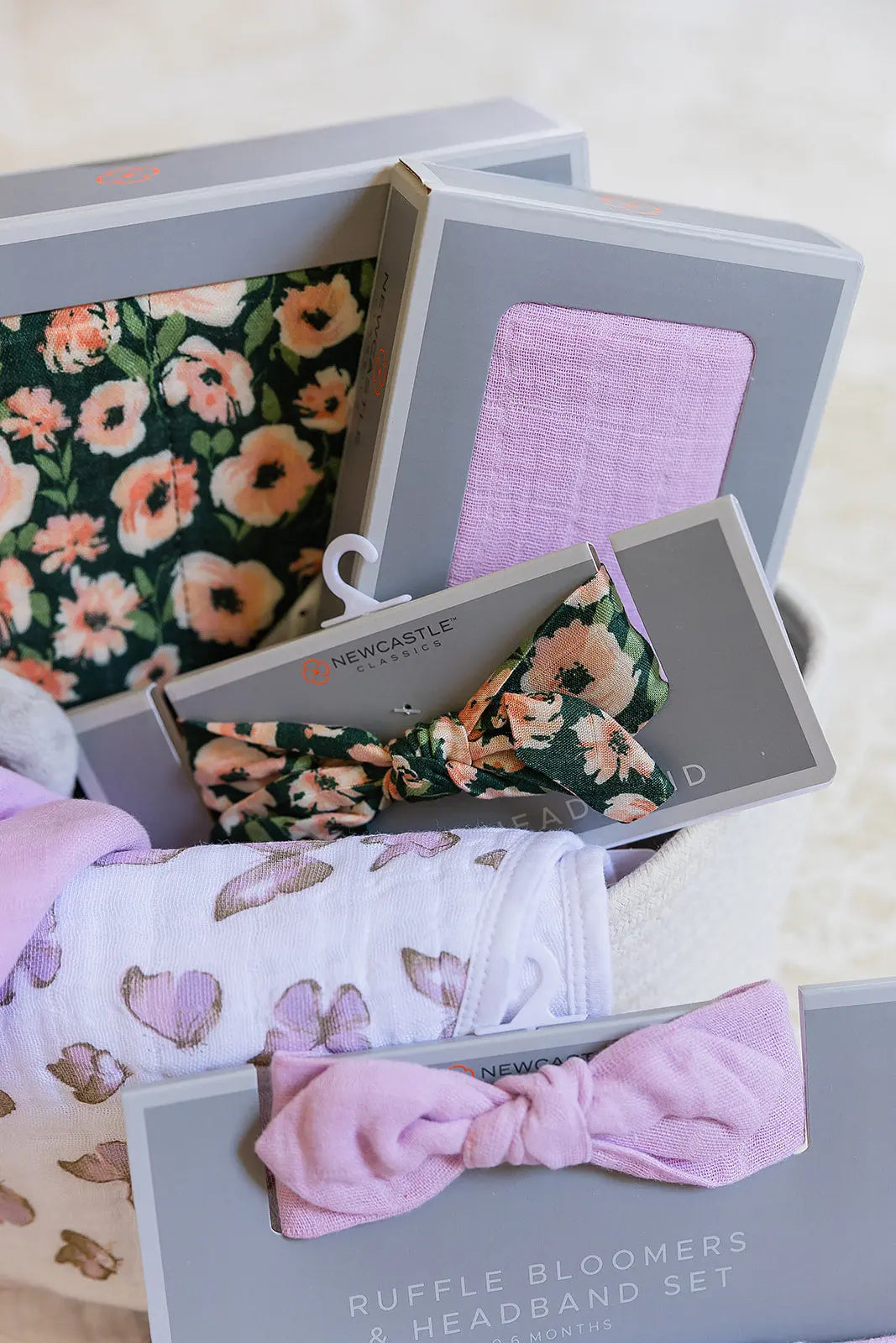 Welcome Baby Girl Flowers and Butterfly Gift Basket with Bamboo Blanket Floral Headband Swaddle Bib Teether and Plush Rabbit Newcastle Classics