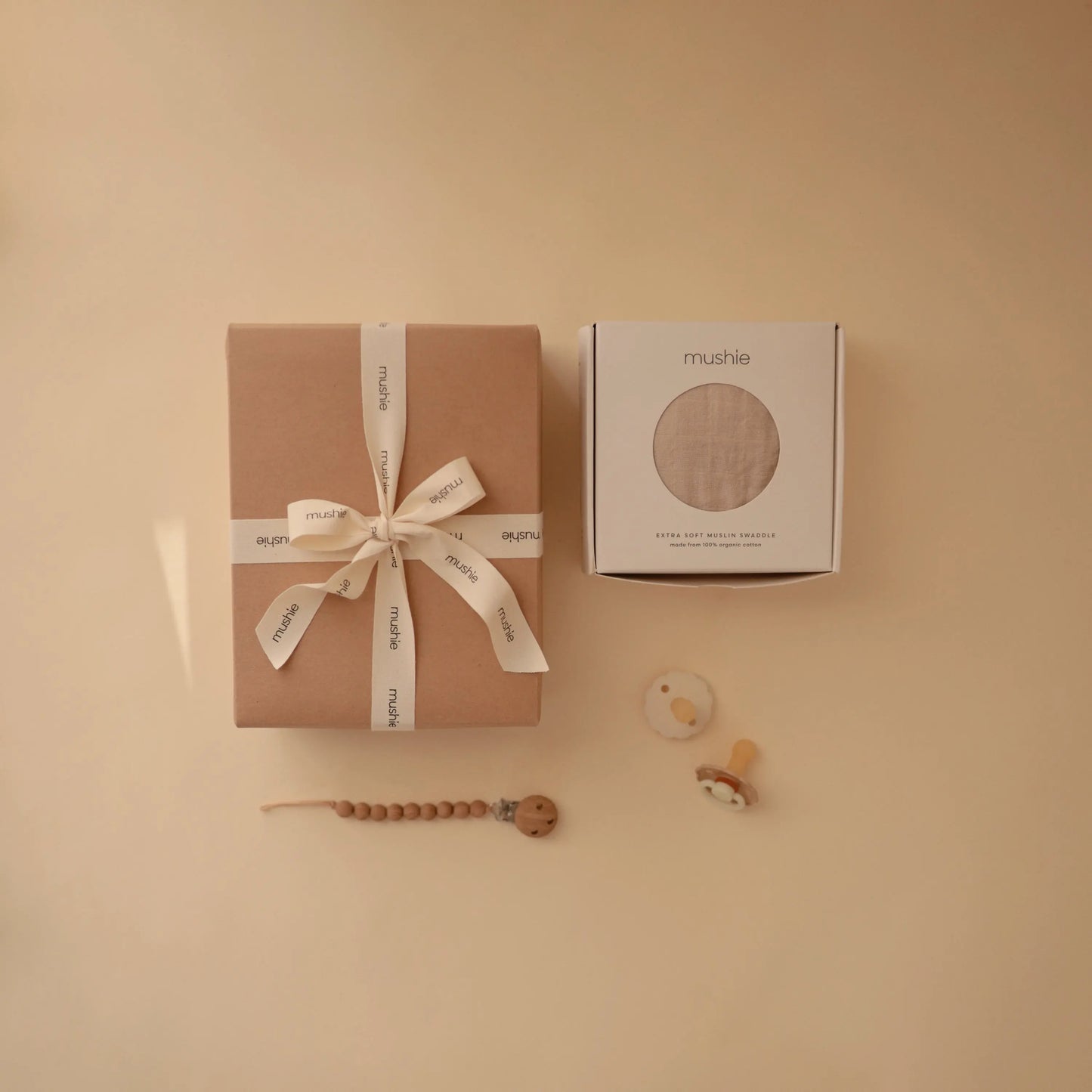 Newborn Mini Gift Set with Organic Cotton Muslin Swaddle FRIGG Daisy Night Pacifiers and Hera Silicone Pacifier Clip Mushie Everetts Place: Online Boutique