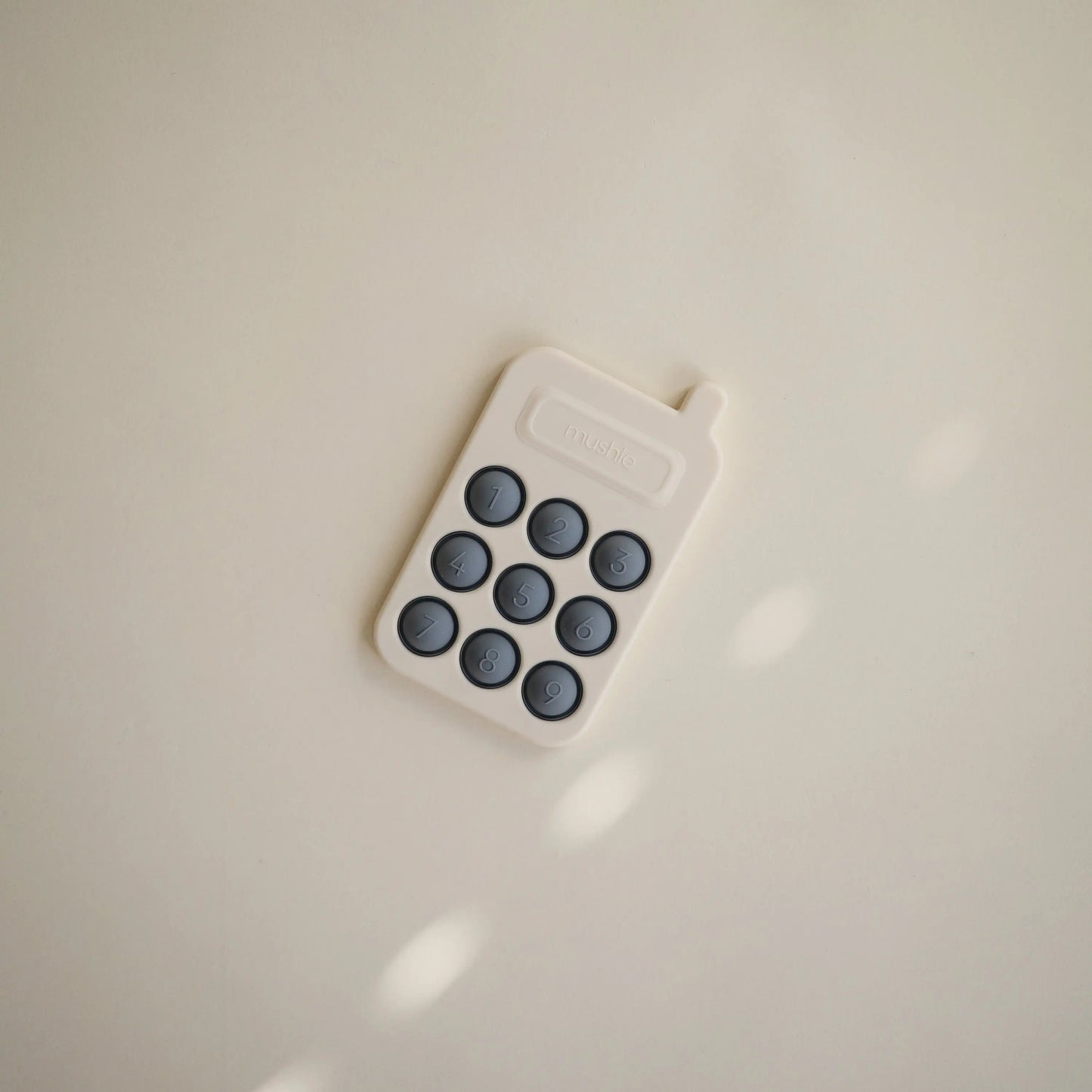 Phone Press Toy for Sensory Exploration and Fine Motor Skill Development Mushie Everetts Place: Online Boutique
