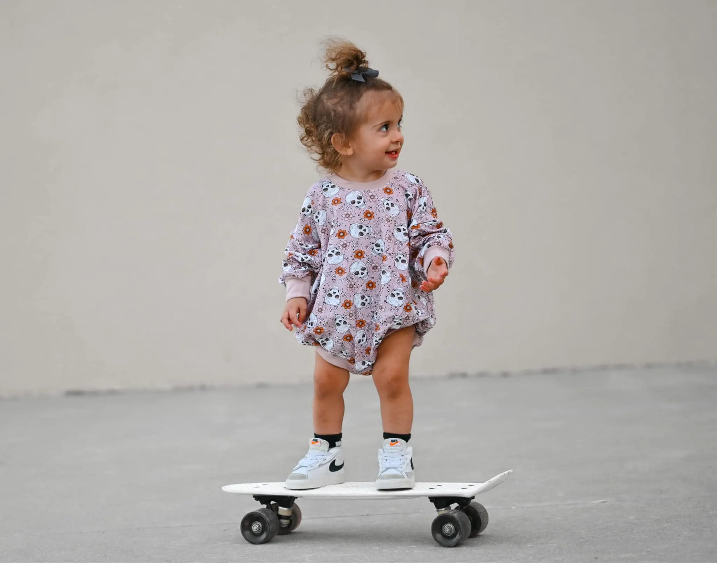 Purple Floral Skulls Bamboo Bubble Romper Little Joy Co. Everetts Place: Online Boutique