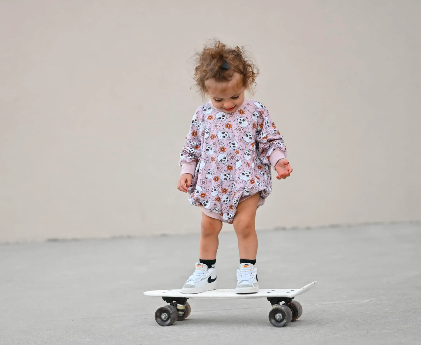 Purple Floral Skulls Bamboo Bubble Romper Little Joy Co. Everetts Place: Online Boutique
