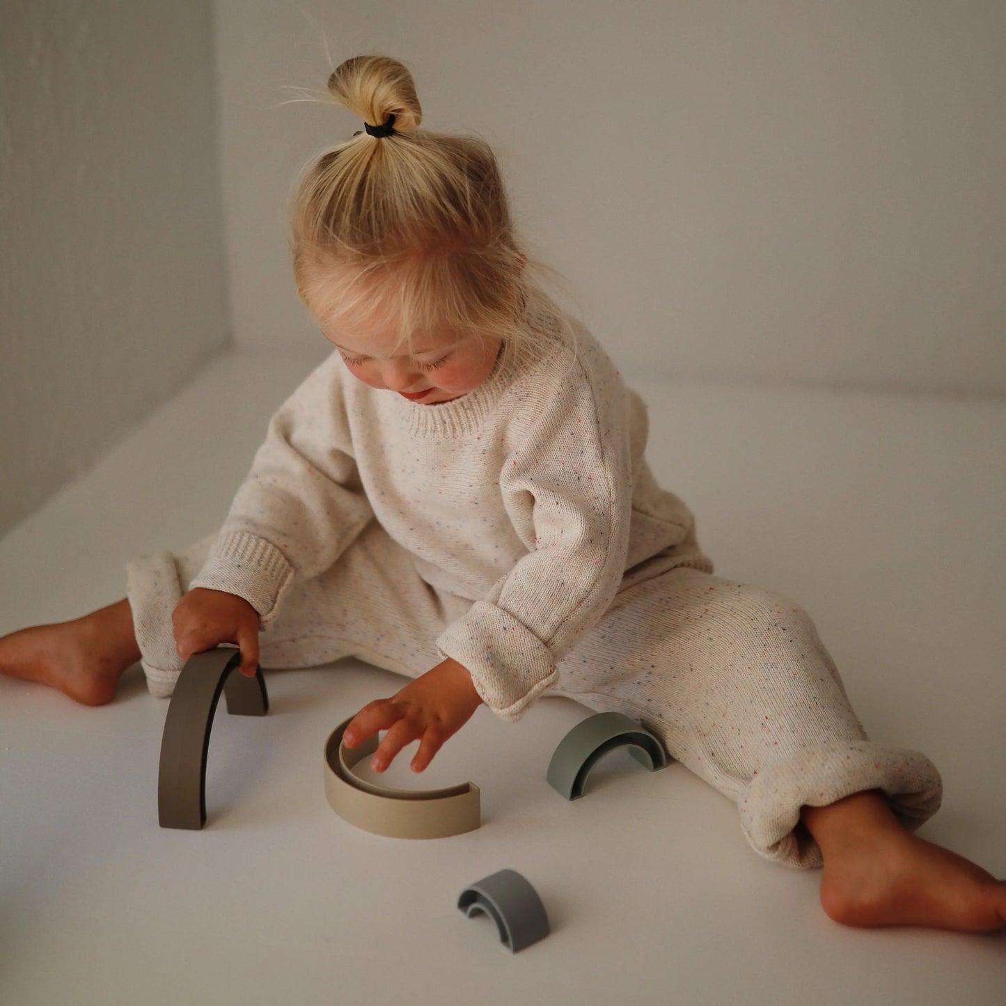 Rainbow Stacker Toy from Danish Hygge Collection for Learning and Play Mushie Everetts Place: Online Boutique