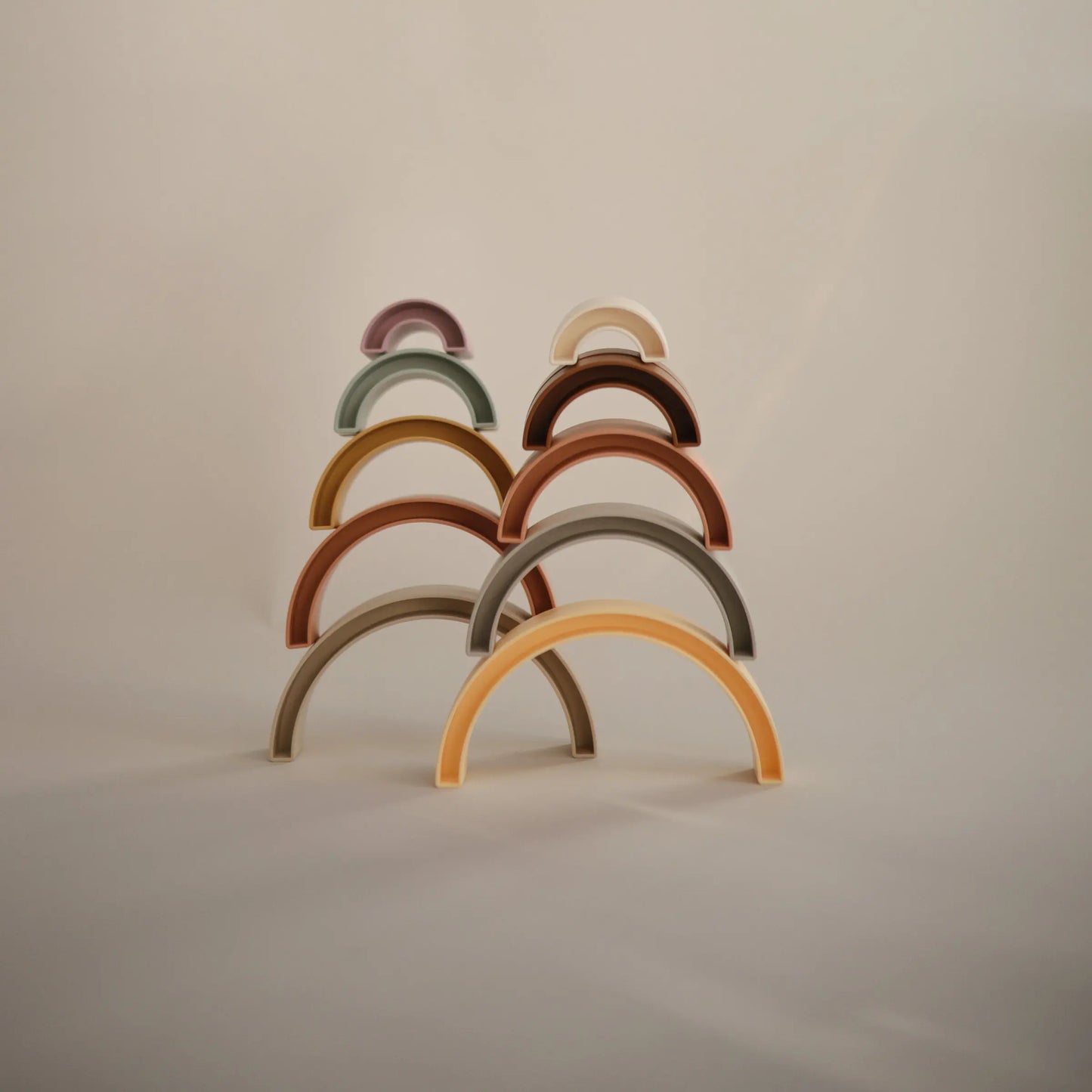 Rainbow Stacker Toy from Danish Hygge Collection for Learning and Play Mushie Everetts Place: Online Boutique