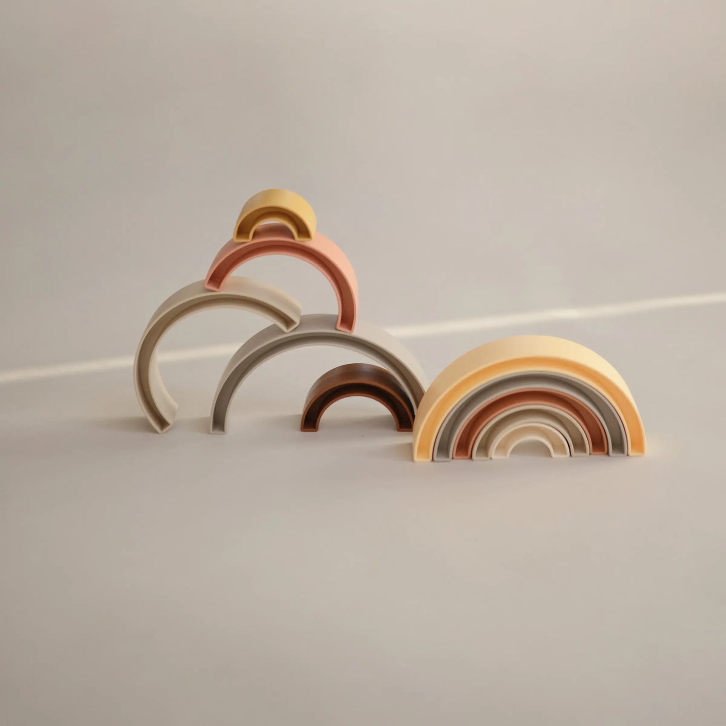 Rainbow Stacker Toy from Danish Hygge Collection for Learning and Play Mushie Everetts Place: Online Boutique