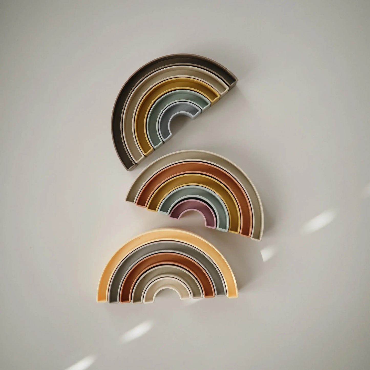 Rainbow Stacker Toy from Danish Hygge Collection for Learning and Play Mushie Everetts Place: Online Boutique