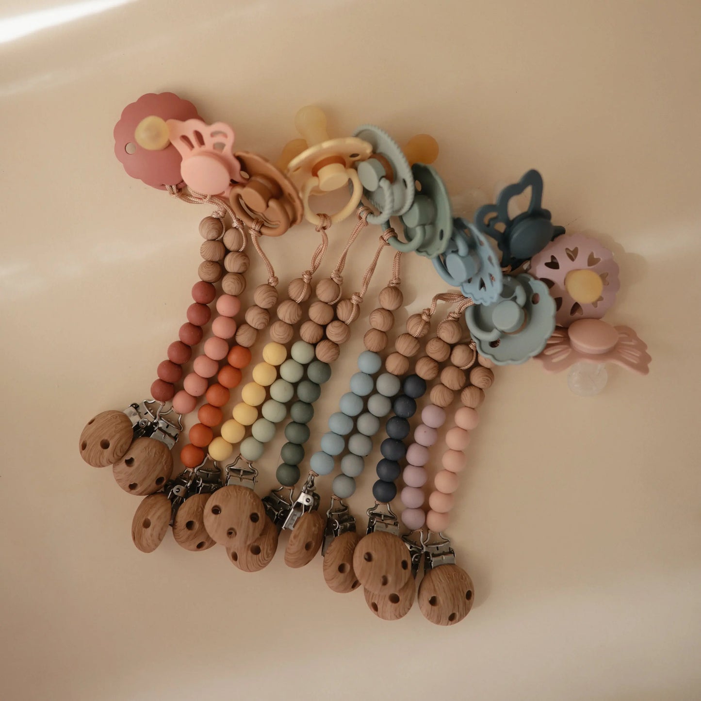 Silicone Pacifier Clip Eva with Faux Wood Clasp and Colorful Beads Mushie Everetts Place: Online Boutique