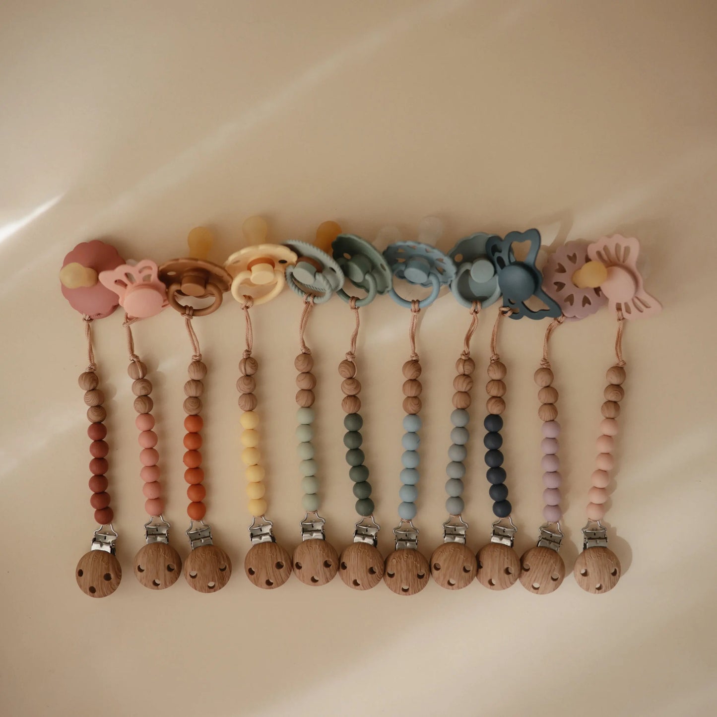 Silicone Pacifier Clip Eva with Faux Wood Clasp and Colorful Beads Mushie Everetts Place: Online Boutique
