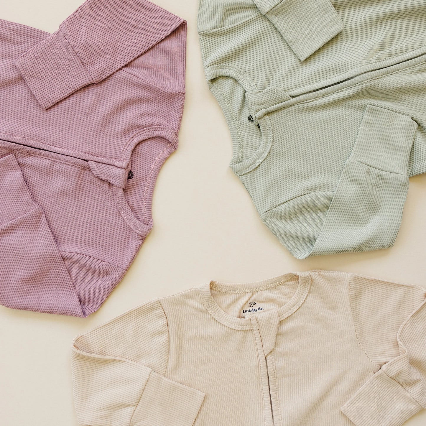 Solid Ribbed Bamboo Zippy Romper for Babies in Colors Little Joy Co. Everetts Place: Online Boutique