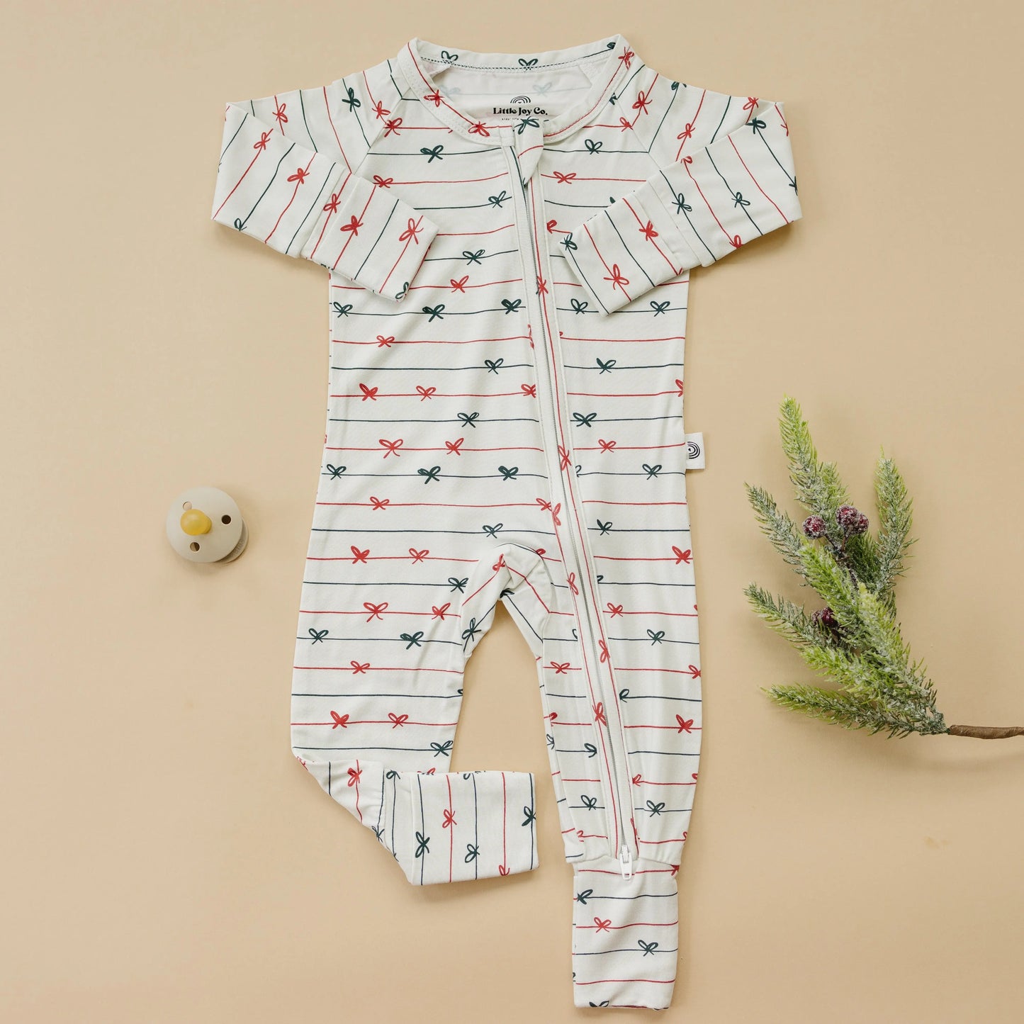 Tied With a Bow Christmas Bamboo Zippy Romper for Babies Little Joy Co. Everetts Place: Online Boutique