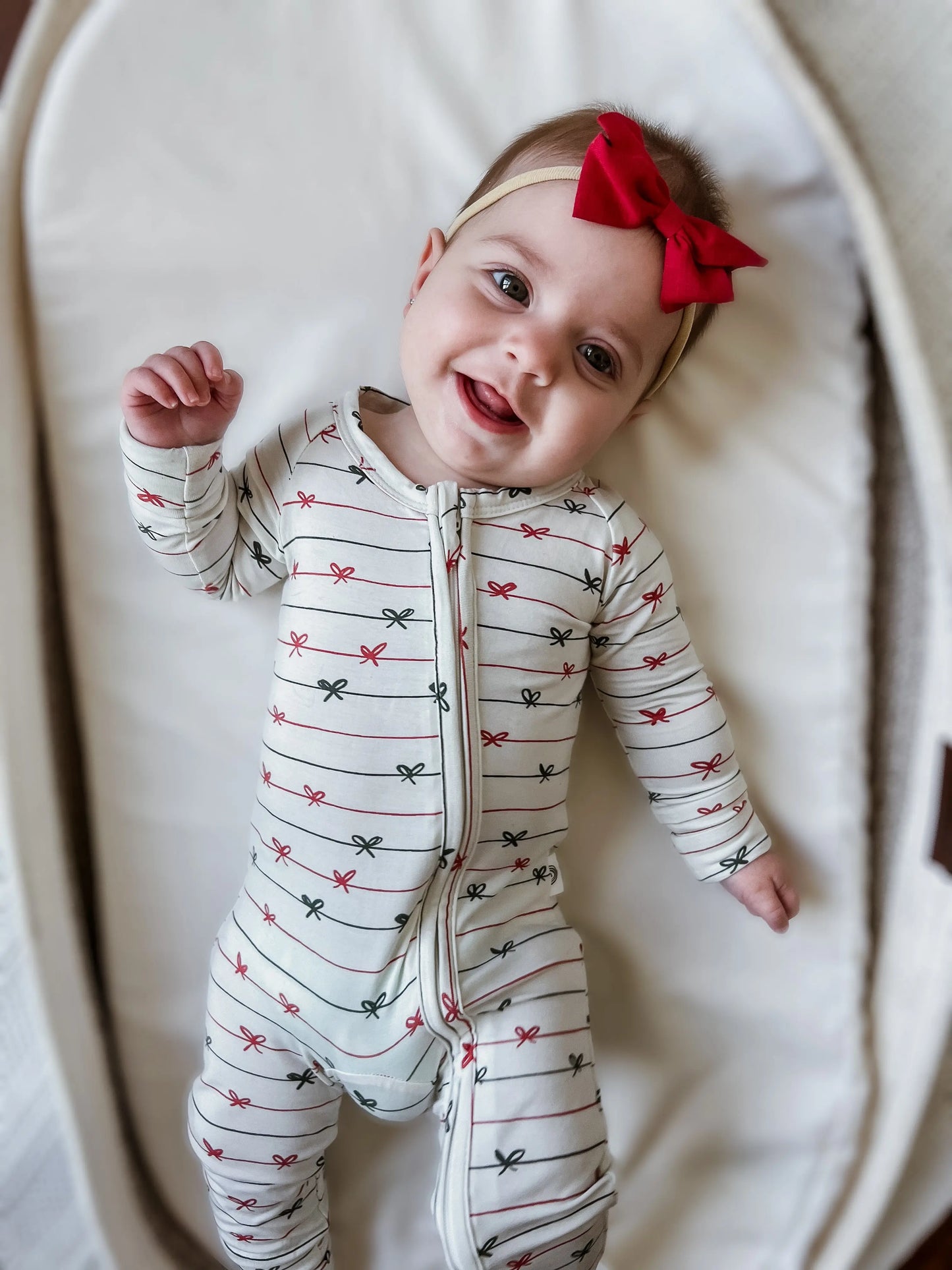 Tied With a Bow Christmas Bamboo Zippy Romper for Babies Little Joy Co. Everetts Place: Online Boutique