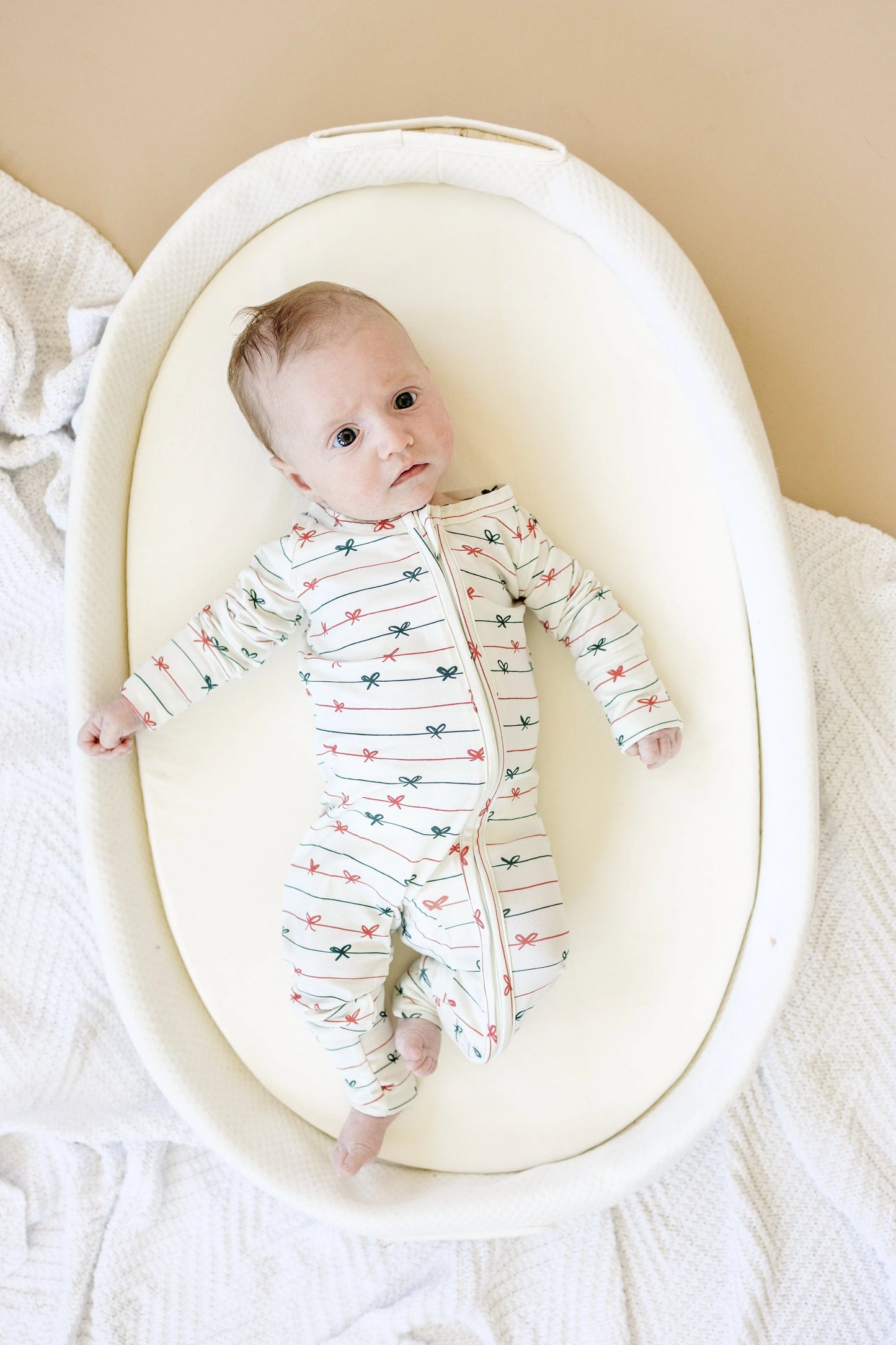 Tied With a Bow Christmas Bamboo Zippy Romper for Babies Little Joy Co. Everetts Place: Online Boutique