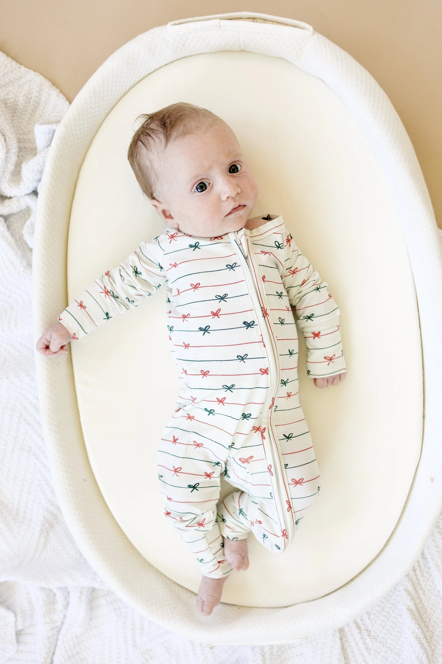 Tied With a Bow Christmas Bamboo Zippy Romper for Babies Little Joy Co. Everetts Place: Online Boutique