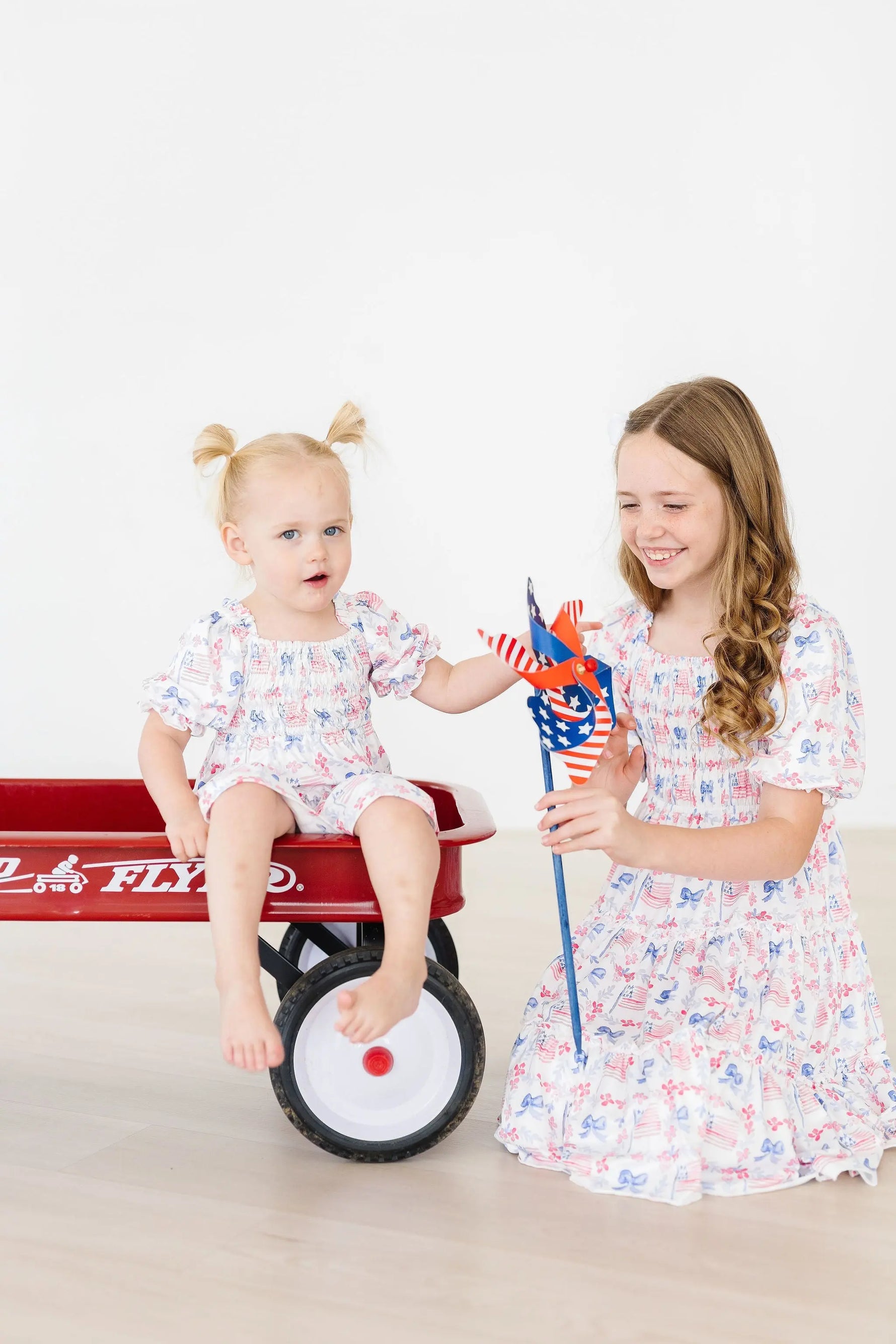 Vintage Flags Smocked Ruffle Dress Girls Mila Rose Mila & Rose ® Everetts Place: Online Boutique