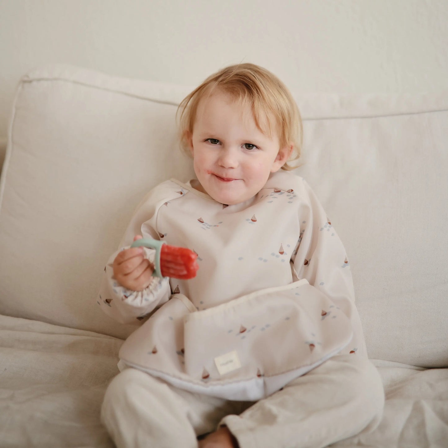 Water Resistant Long Sleeve Bib for Kids with Wide Pocket and Velcro Closure Mushie Everetts Place: Online Boutique