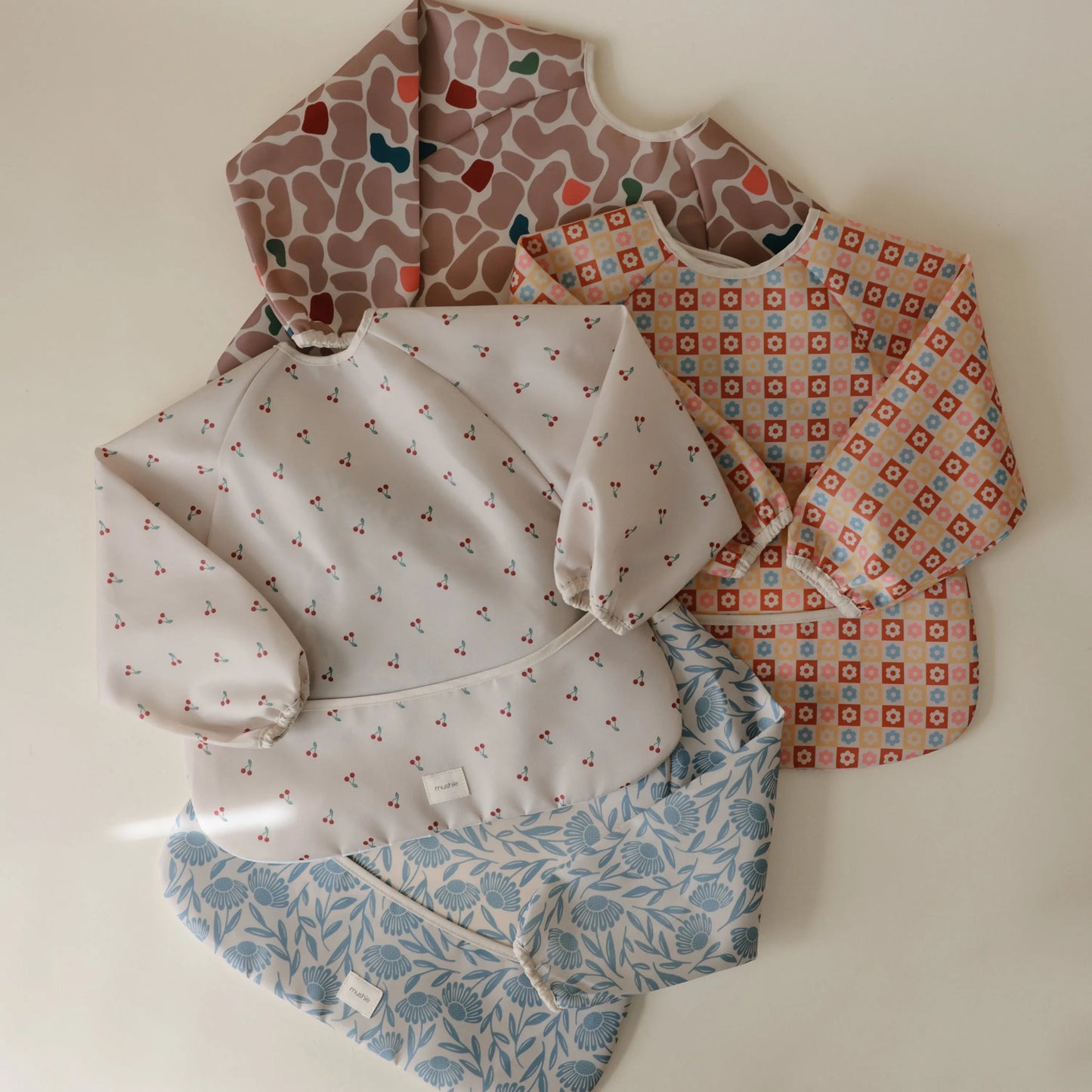Water Resistant Long Sleeve Bib for Kids with Wide Pocket and Velcro Closure Mushie Everetts Place: Online Boutique