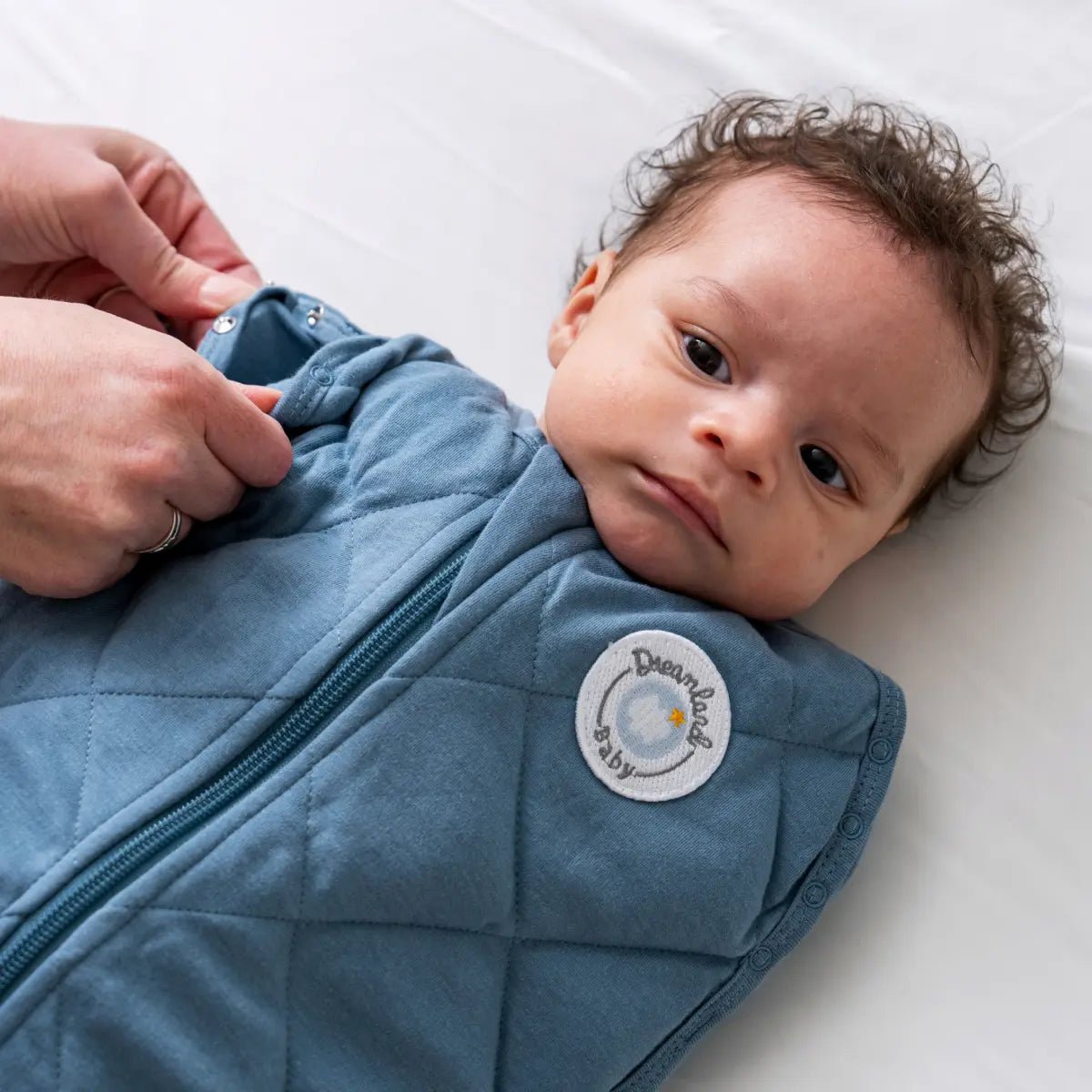 Dream Weighted Sleep Swaddle with CoverCalm Technology for Newborn Comfort and Better Sleep.