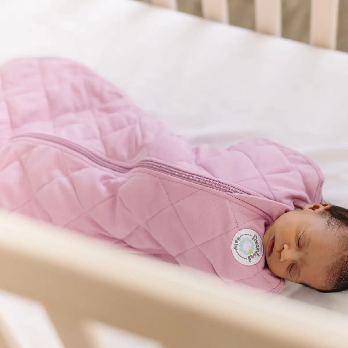 Dream Weighted Sleep Swaddle with CoverCalm Technology for Newborn Comfort and Better Sleep.