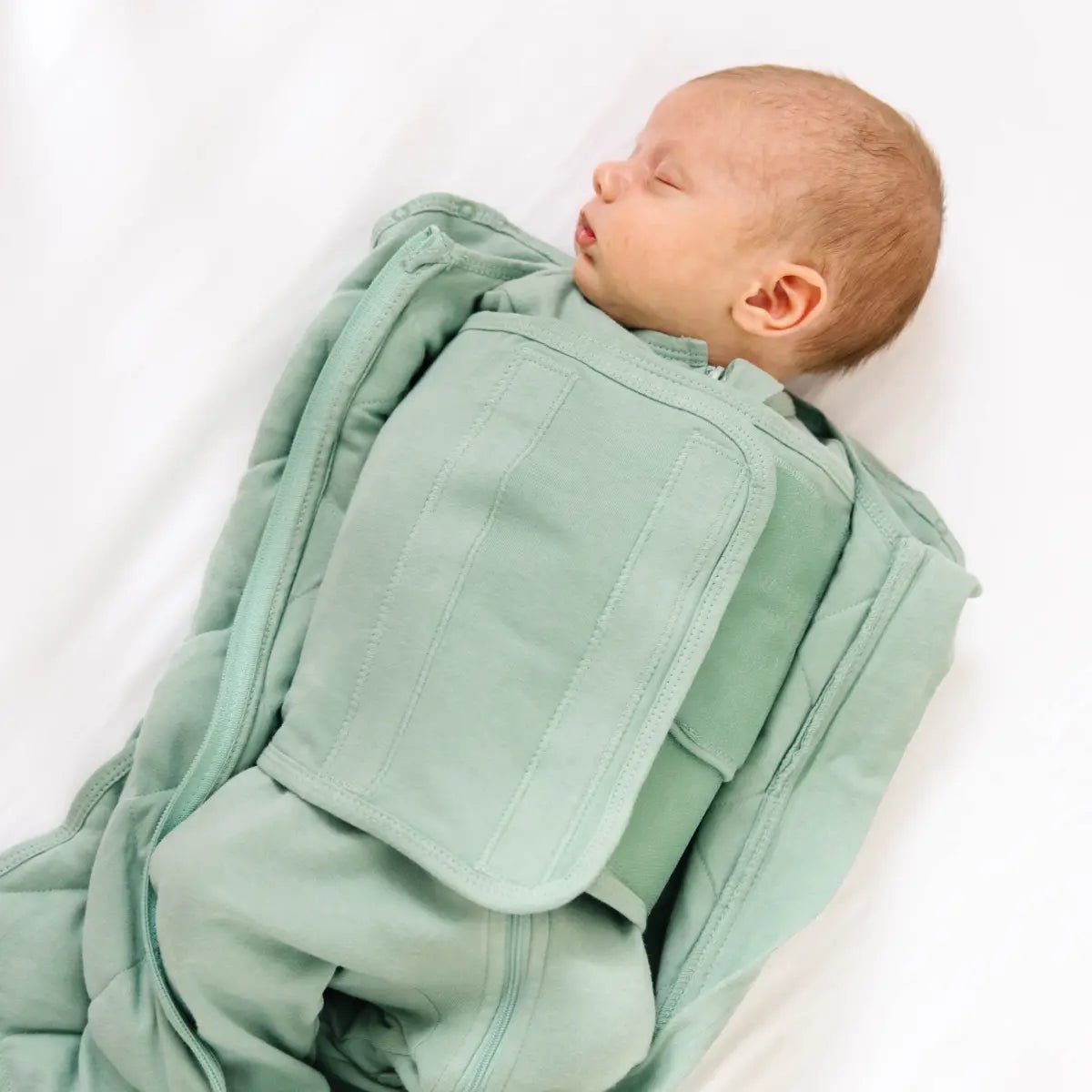Dream Weighted Sleep Swaddle with CoverCalm Technology for Newborn Comfort and Better Sleep.