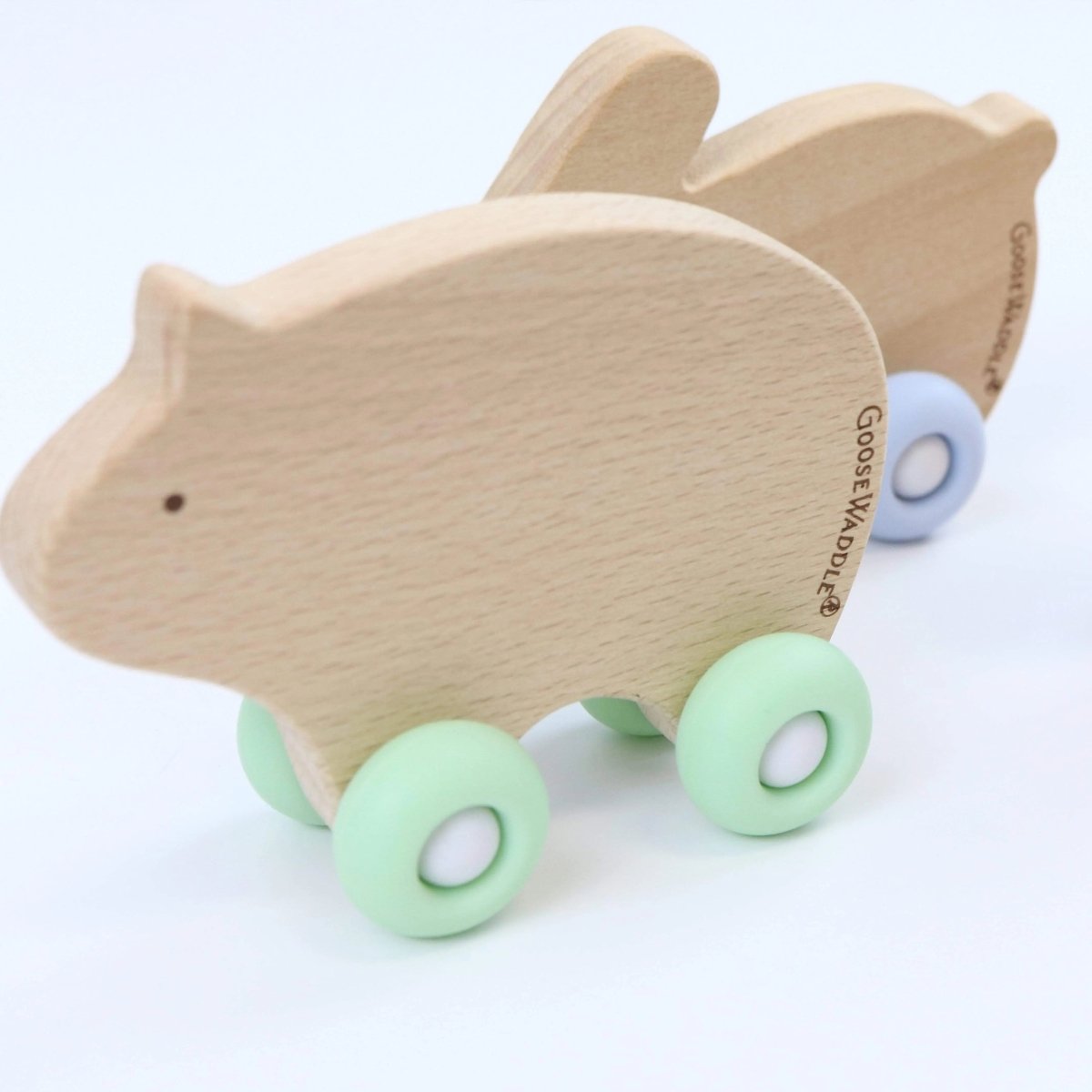 Silicone and Wood Teether with Wheels in Three Colors.