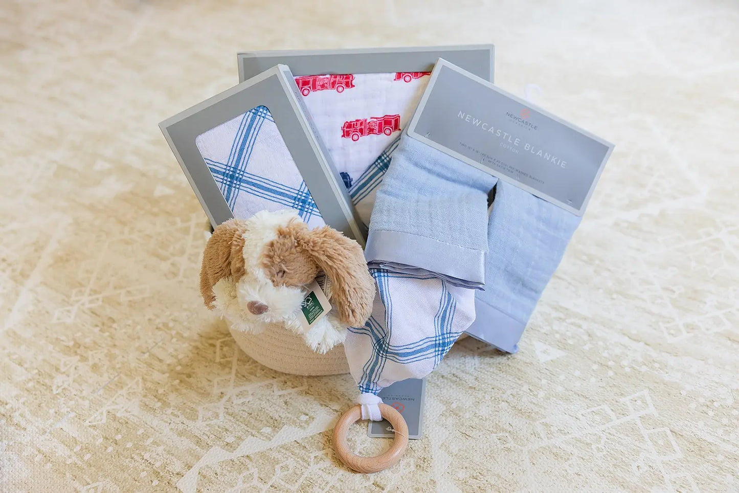 Welcome Baby Boy Firetruck and Blue Plaid Basket with Cotton Blanket Swaddle Blankie Set and Plush Dog Toy Newcastle Classics