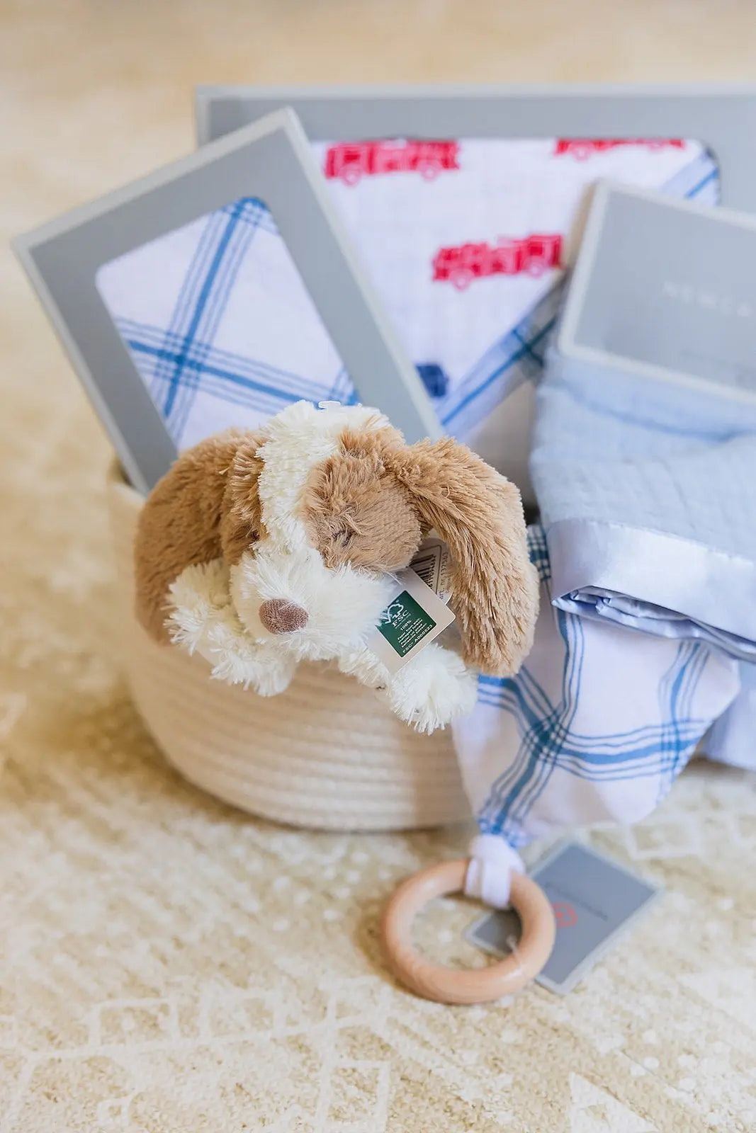 Welcome Baby Boy Firetruck and Blue Plaid Basket with Cotton Blanket Swaddle Blankie Set and Plush Dog Toy Newcastle Classics