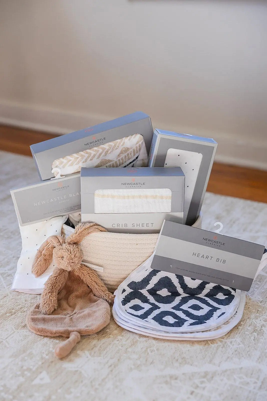 Welcome Baby Gender Neutral Gift Basket with Cotton Blanket Bamboo Swaddle Crib Sheet Bib Burp Rag and Rabbit Richie Tuttle Newcastle Classics