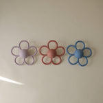 Mushie Daisy Rattle Teether, safe silicone baby toy.