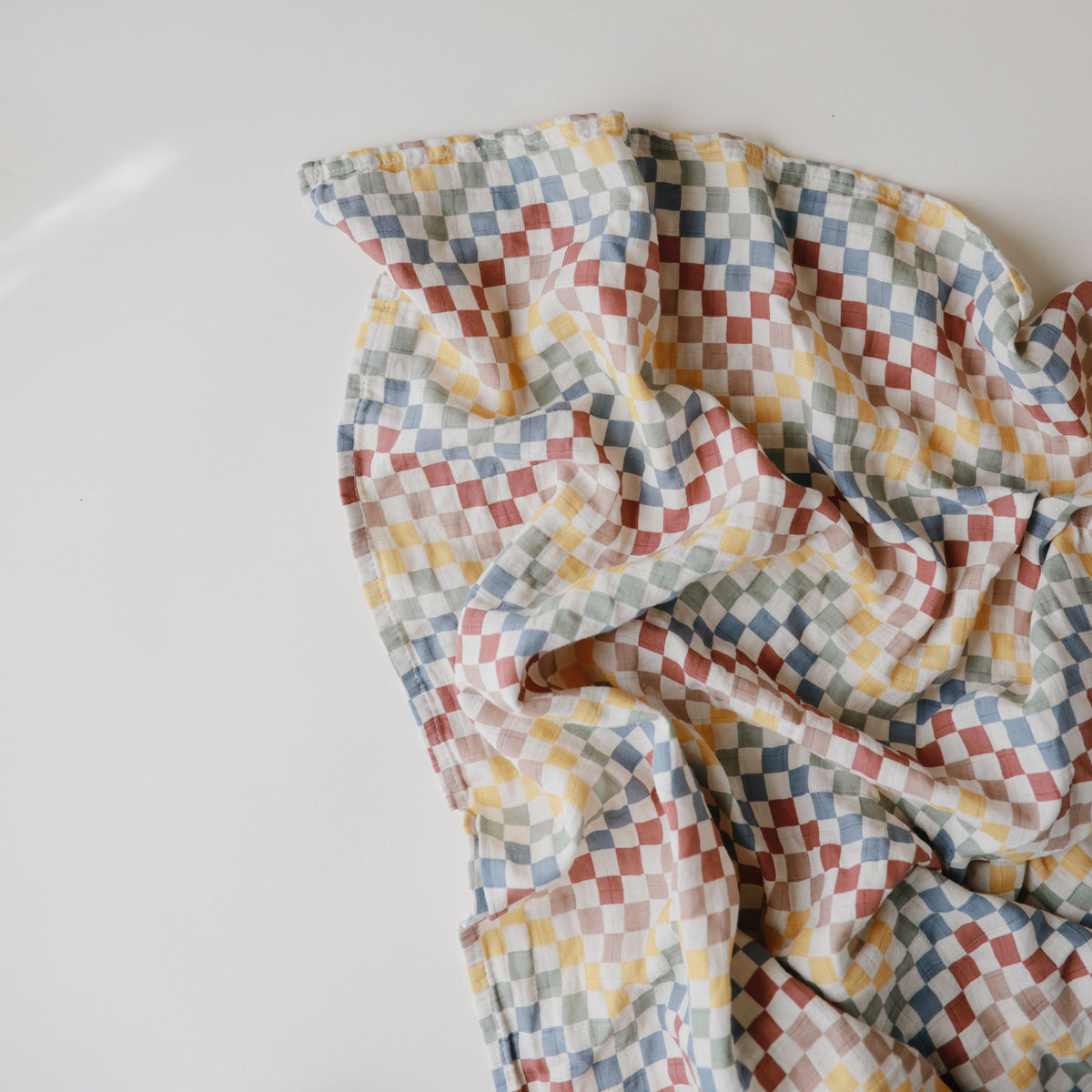 Mushie organic cotton muslin baby swaddle blanket