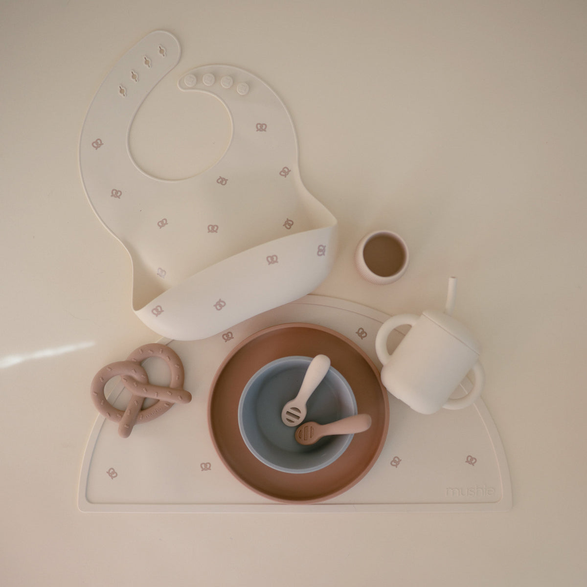 Mushie silicone placemat, non-toxic, non-slip for baby meals.