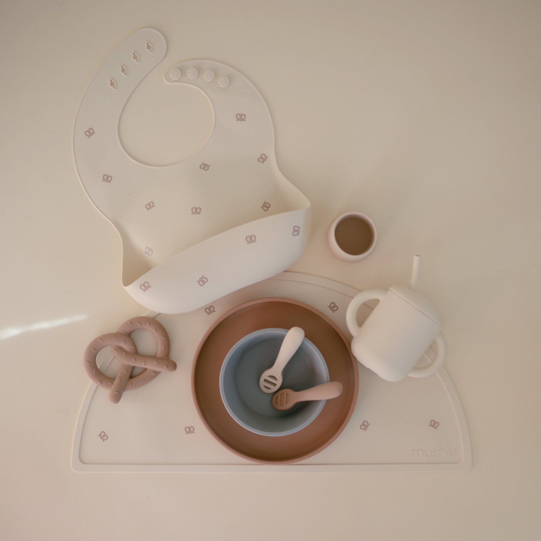 Mushie silicone placemat, non-toxic, non-slip for baby meals.