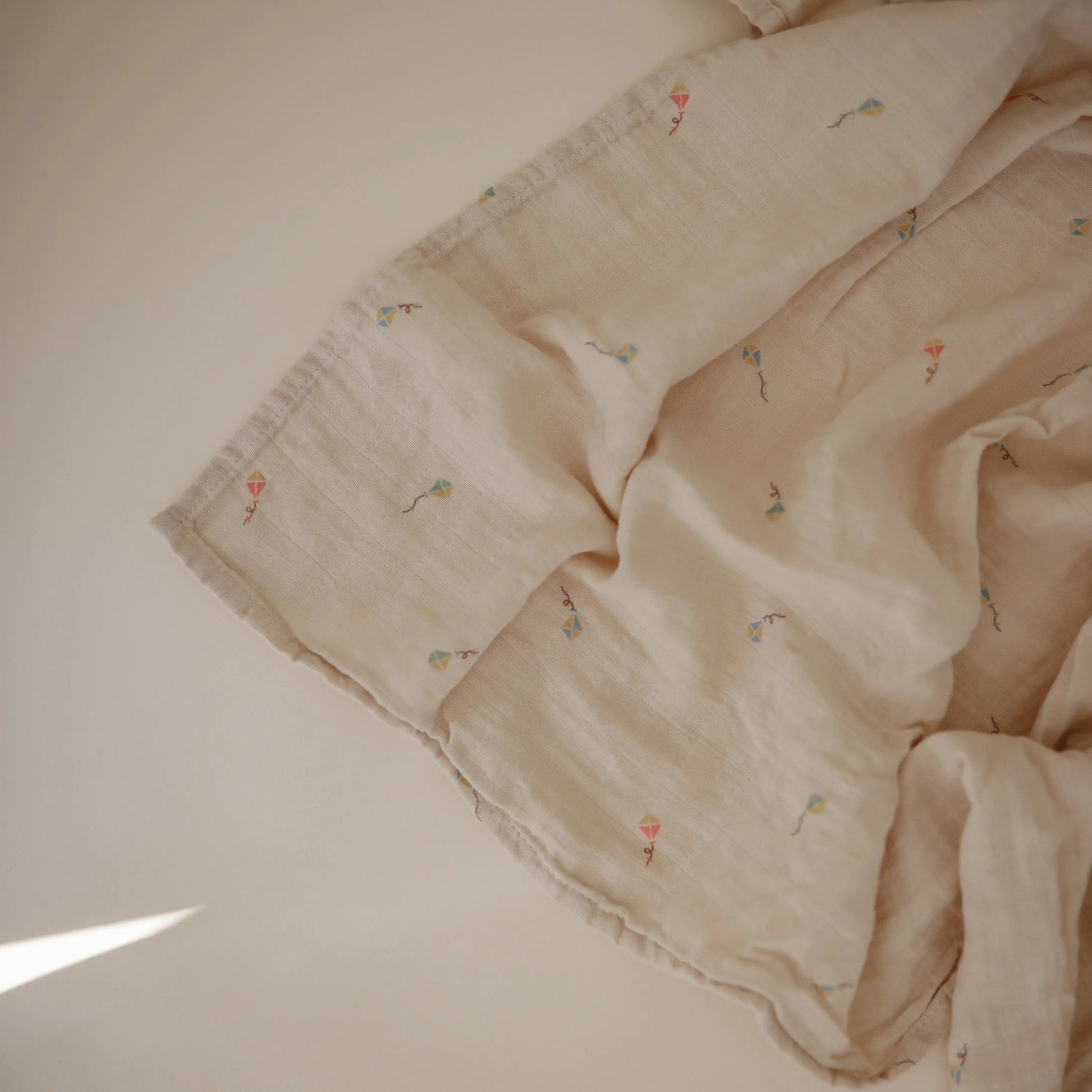 Organic Cotton Muslin Swaddle Blanket for Baby Cuddling and Nursing Mushie