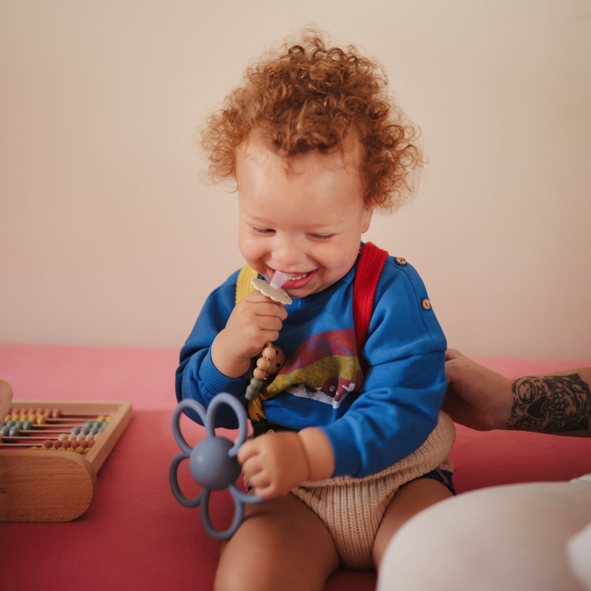 Mushie Daisy silicone baby rattle teether