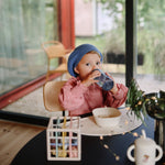 Mushie square silicone dinnerware bowls for baby and toddler feeding.