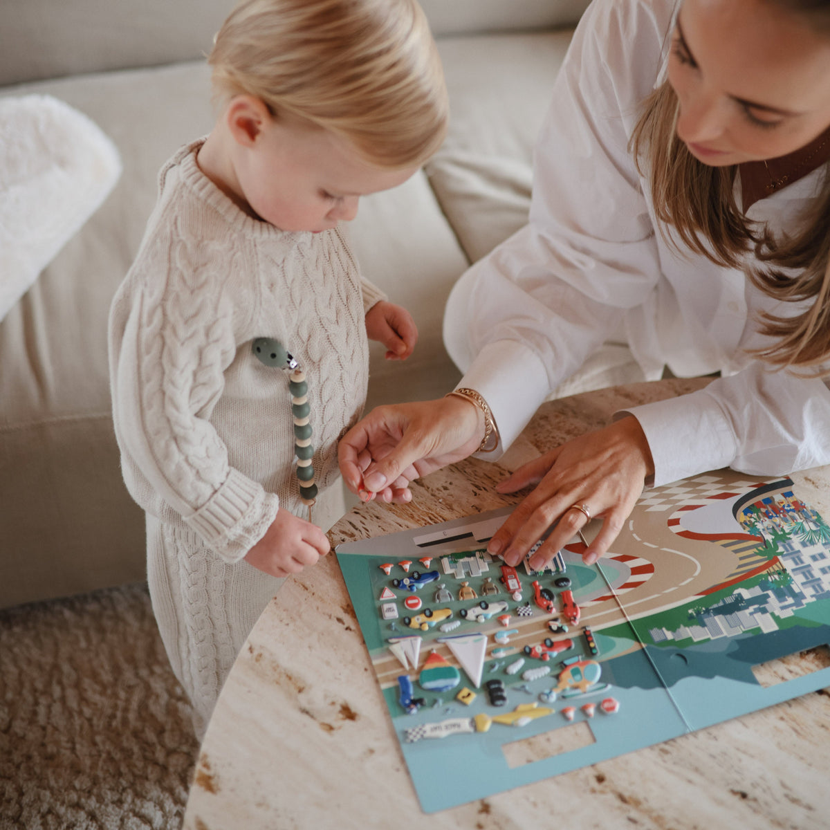 Mushie Reusable Sticker Set with colorful scenes for kids