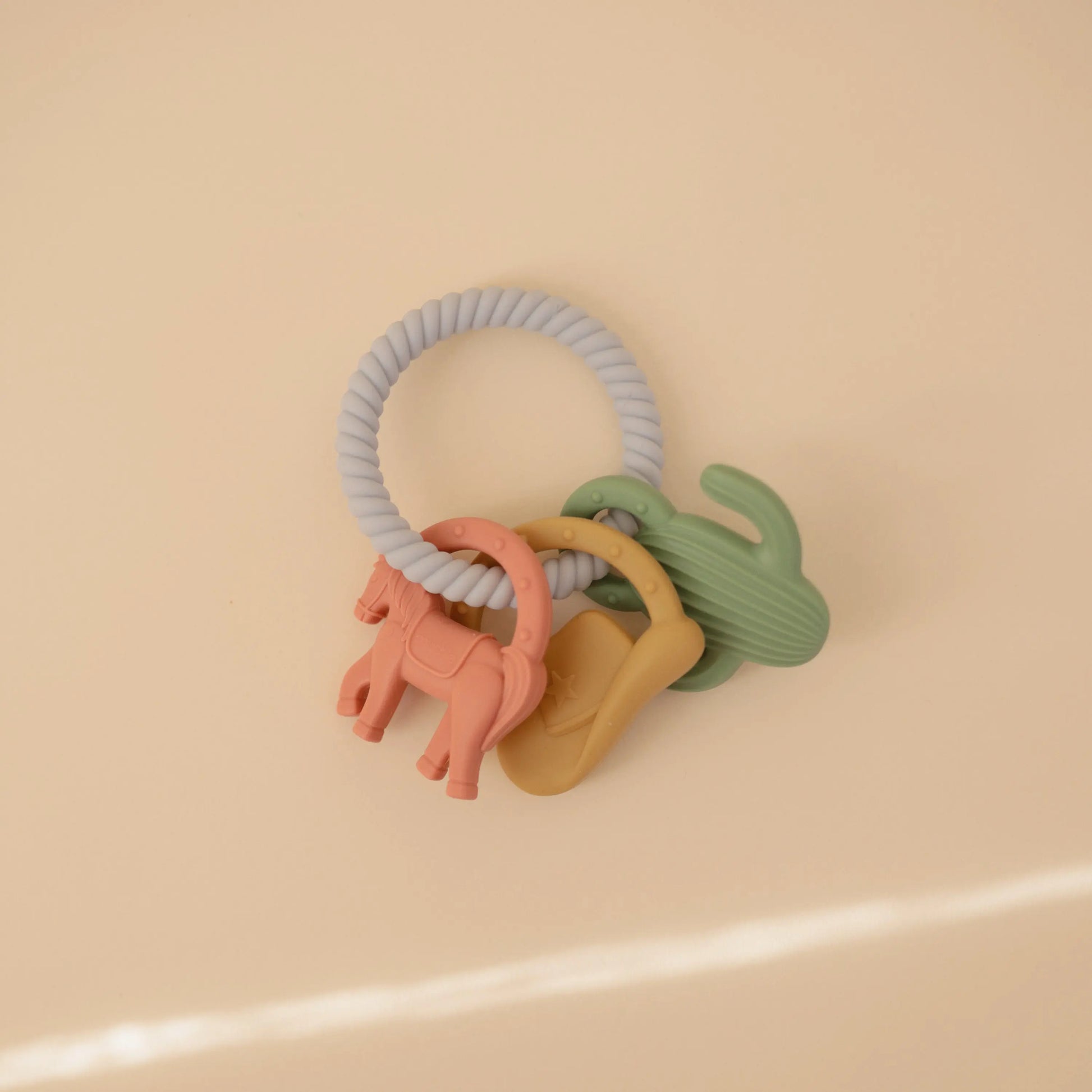 Western Teething Ring Made from Food Grade Silicone with Sensory Shapes and Textures Mushie