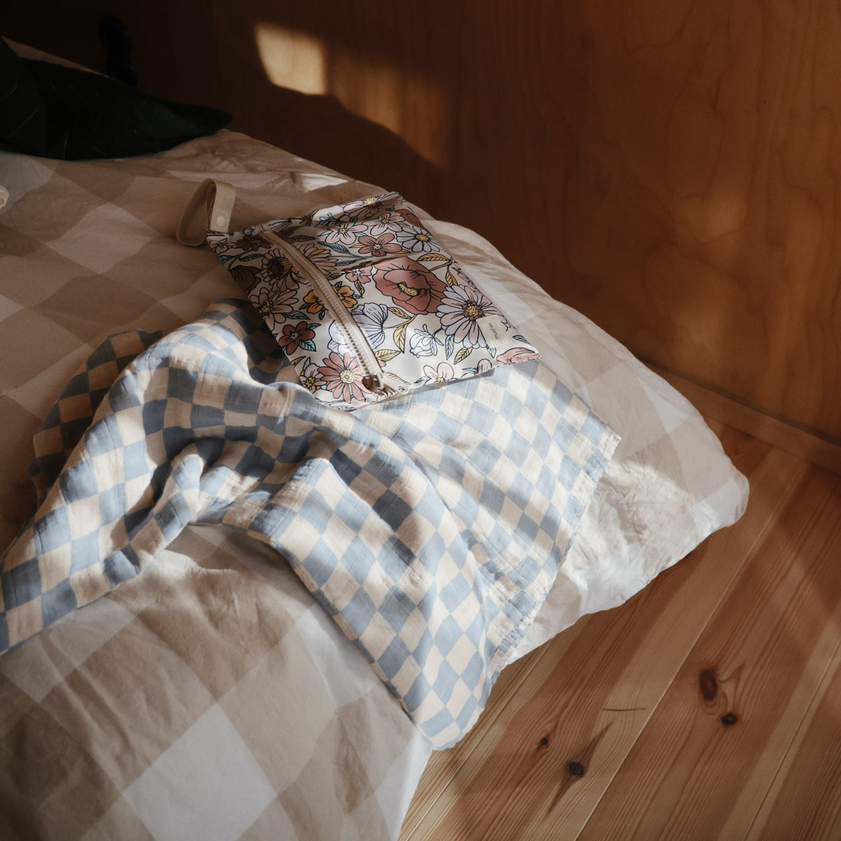 Mushie organic cotton muslin swaddle blanket, soft and breathable for baby.