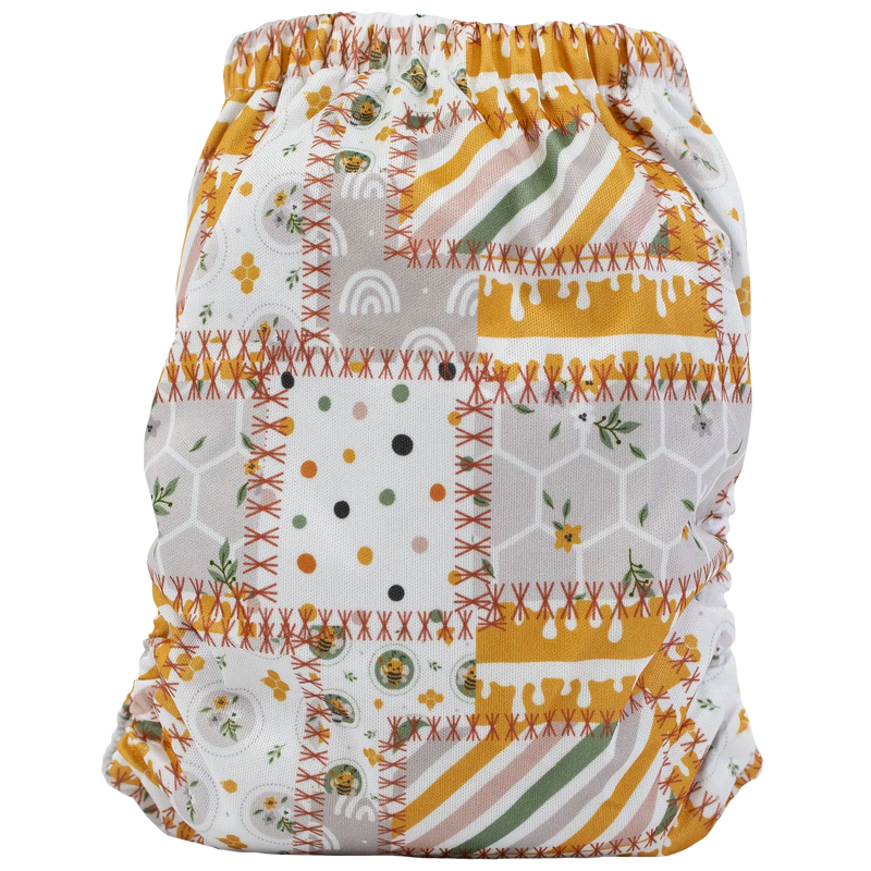 Slim Fit Pocket Cloth Diaper with colorful patchwork design, suitable for 8-40lbs babies.