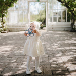 Mushie Daisy Rattle Teether, natural silicone baby teether.