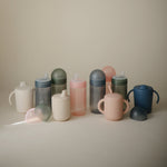 Mushie Soft Spout Sippy Cup for baby's gentle sips, easy grip.