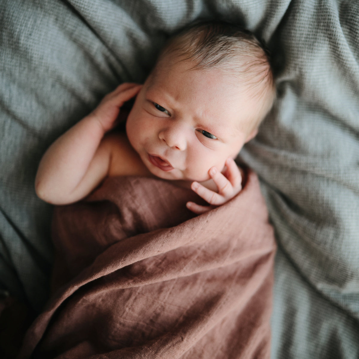 Soft Mushie organic cotton muslin baby swaddle blanket.