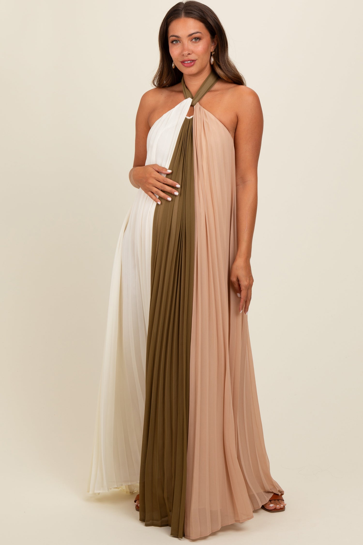 Olive colorblock pleated maternity maxi dress with halter neckline and flowing skirt