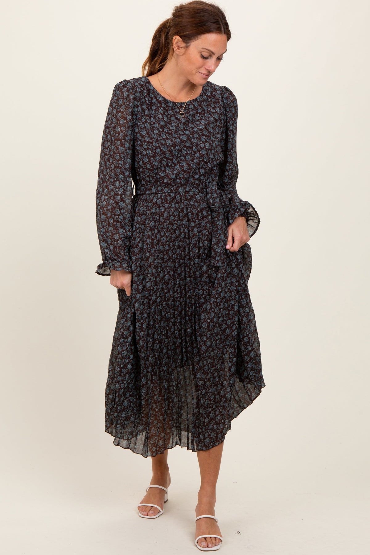 Pleated floral midi dress with long ruffle-cuff sleeves and a front tie waist