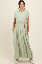 Light olive ruffle trim maxi dress with short sleeves, round neckline, and gathered waist.