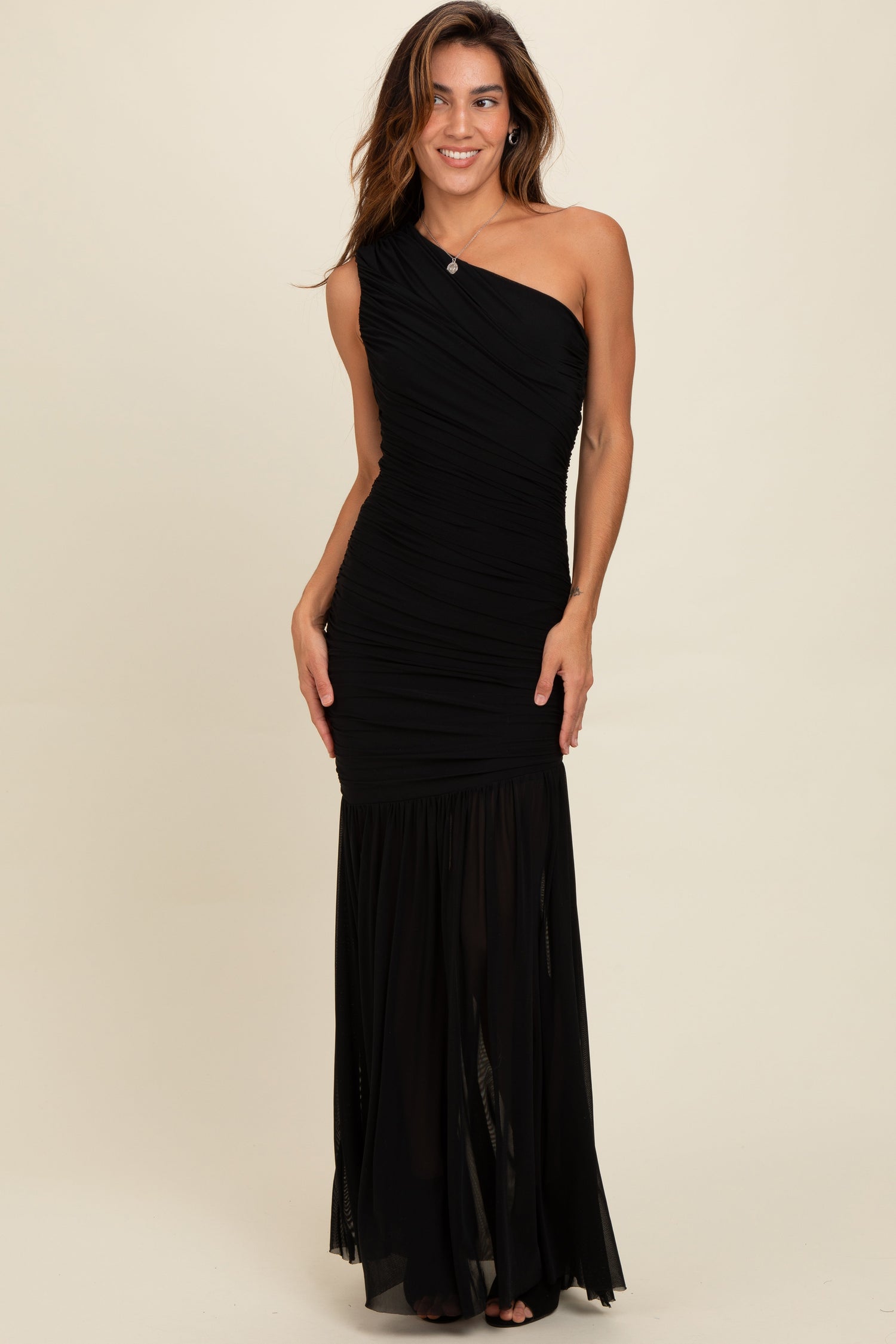 Black one shoulder maxi dress with ruched bodice and a long flowing mesh skirt