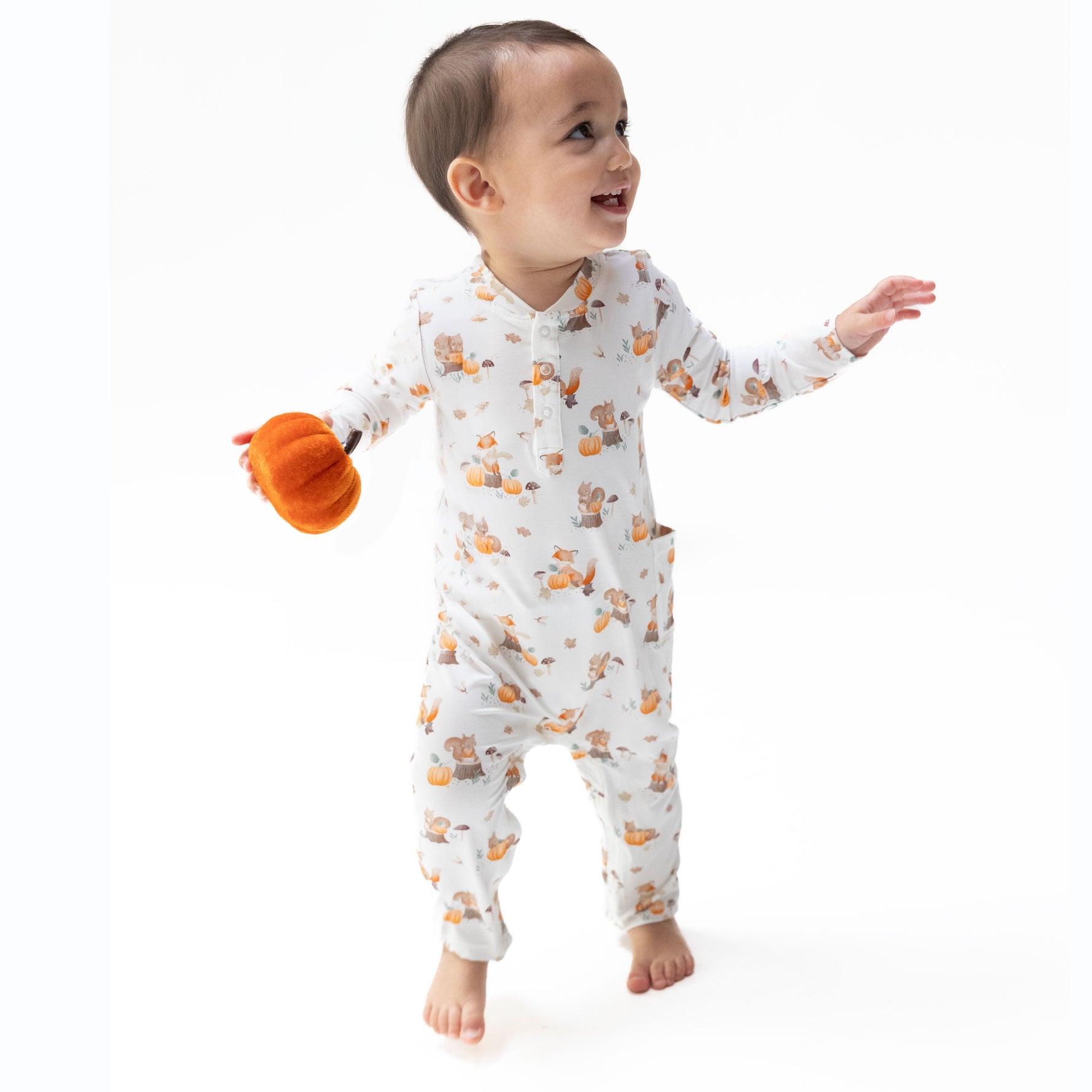 Baby romper with woodland animals and pumpkins print, Henley neckline, and snap closures
