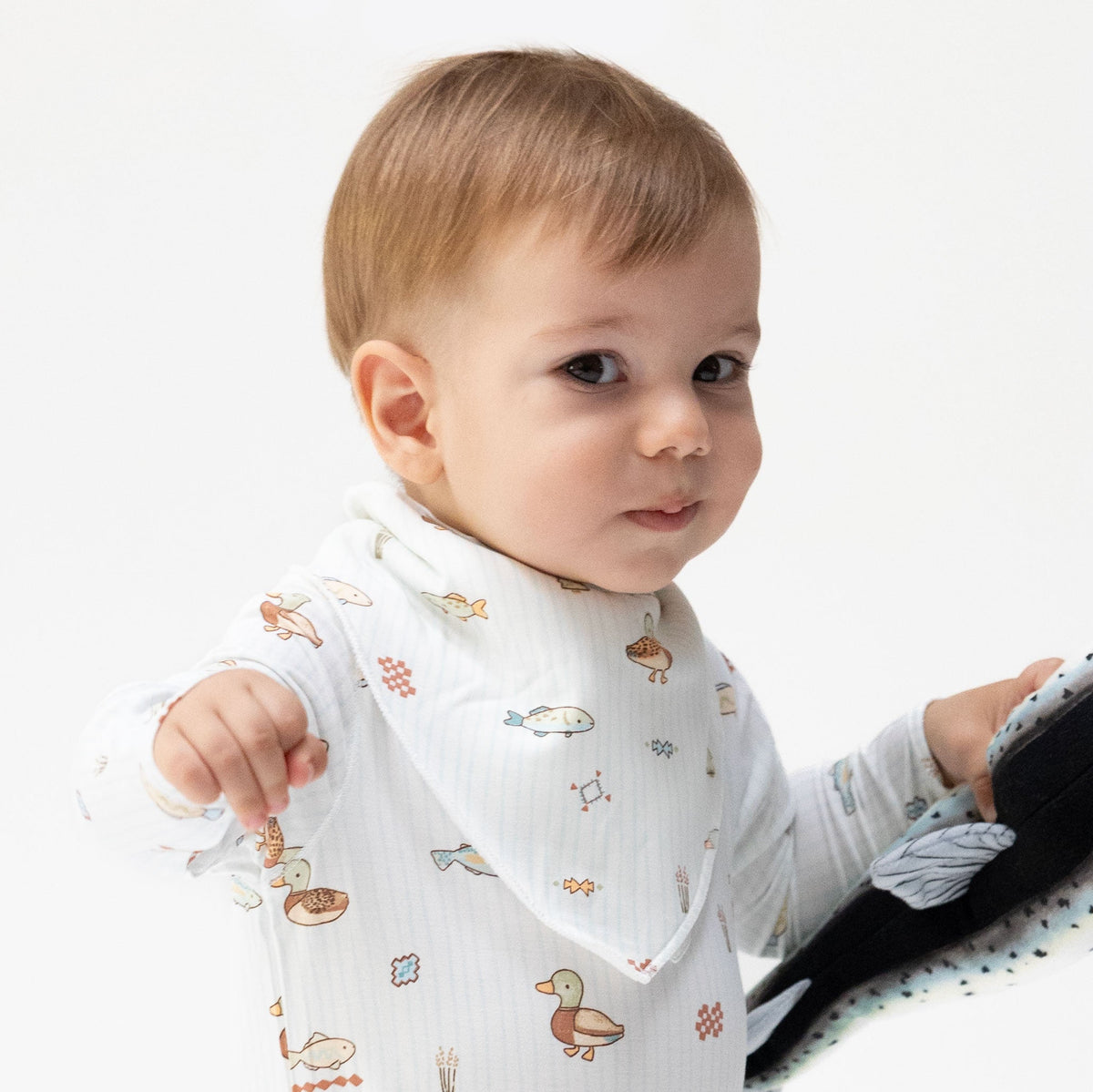 Bandana bib in Lake Cuties print with adjustable snap closure
